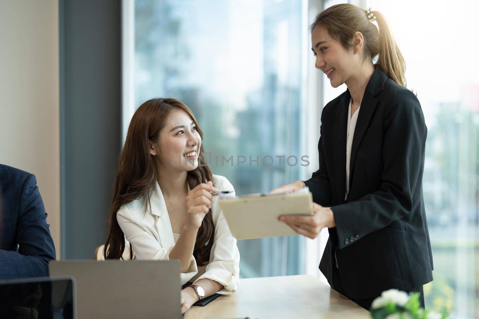 Business people are meeting for analysis data figures to plan business strategies. Business discussing concept.