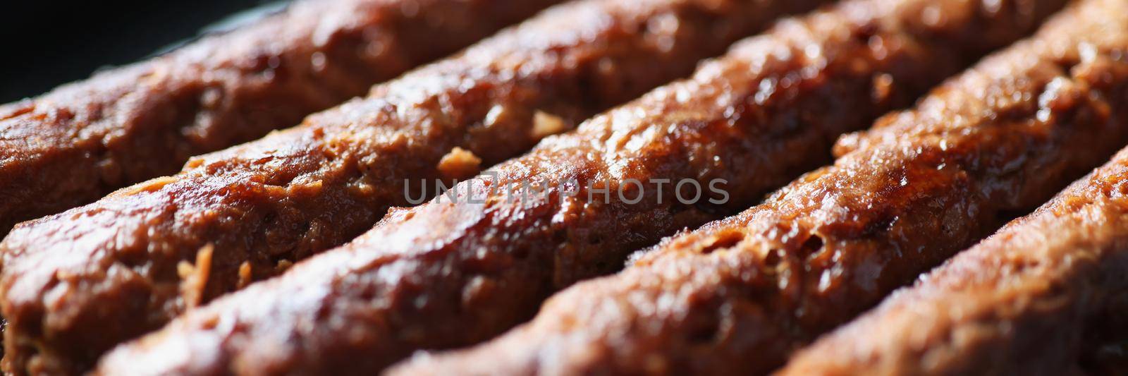 Close-up of tasty and juicy lula kebab. Asian traditional meat dish. Lyulya-kebab minced meat. Traditional turkish food adana kebab. Middle eastern food