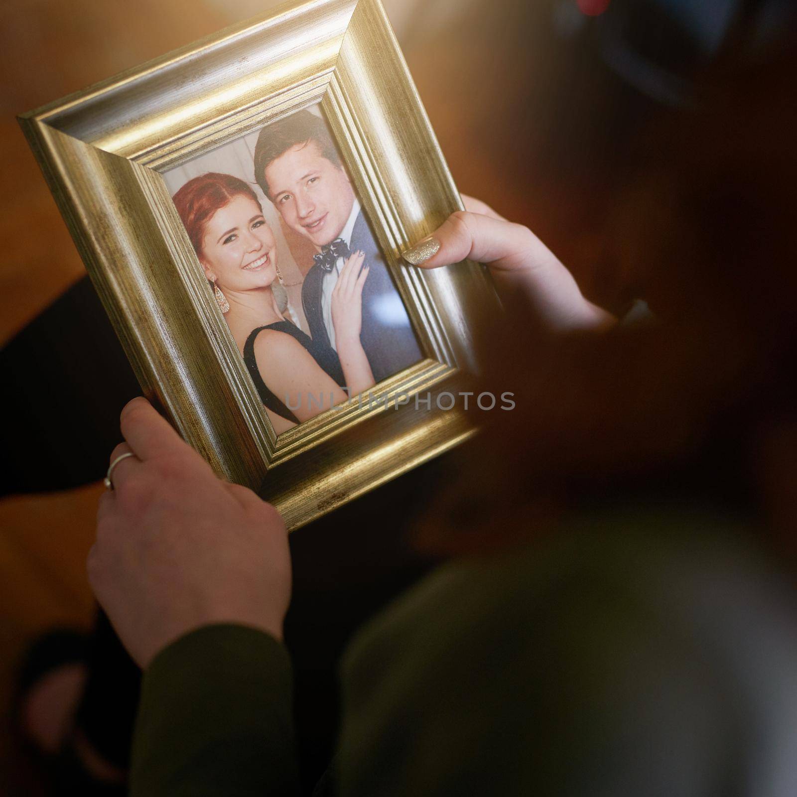 High angle shot of someone holding a wedding photo.