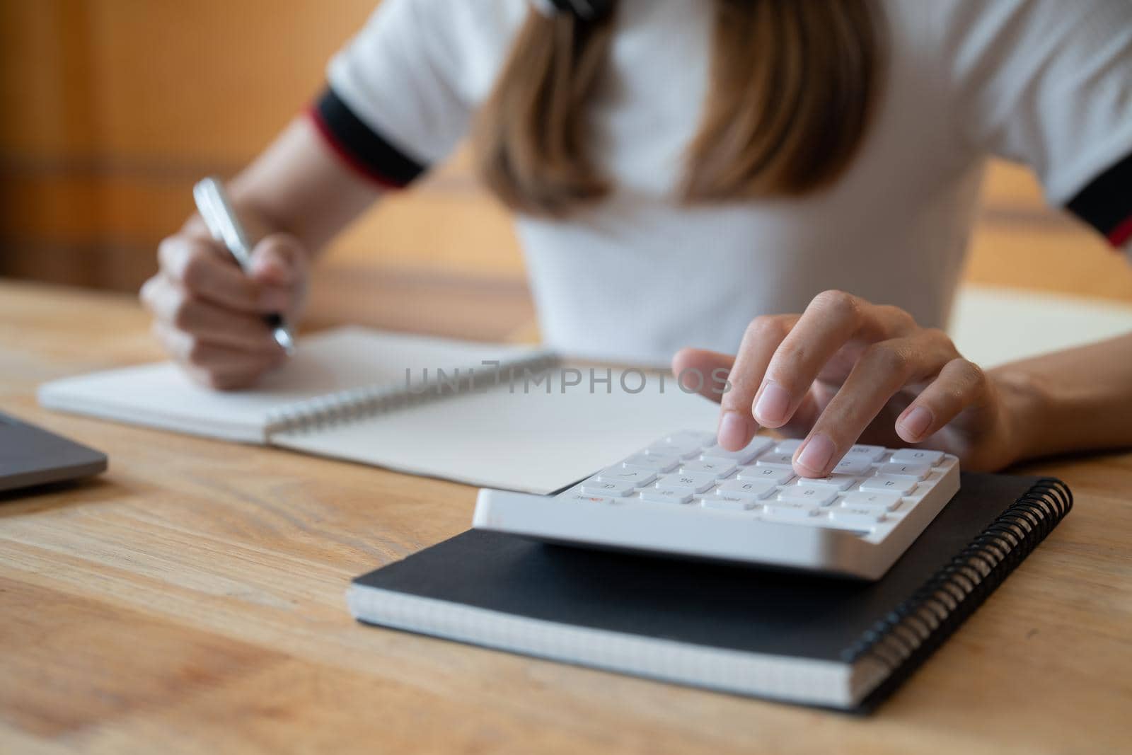 Close up view of bookkeeper or financial inspector hands making report, calculating or checking balance. Home finances, investment, economy, saving money or insurance concept.