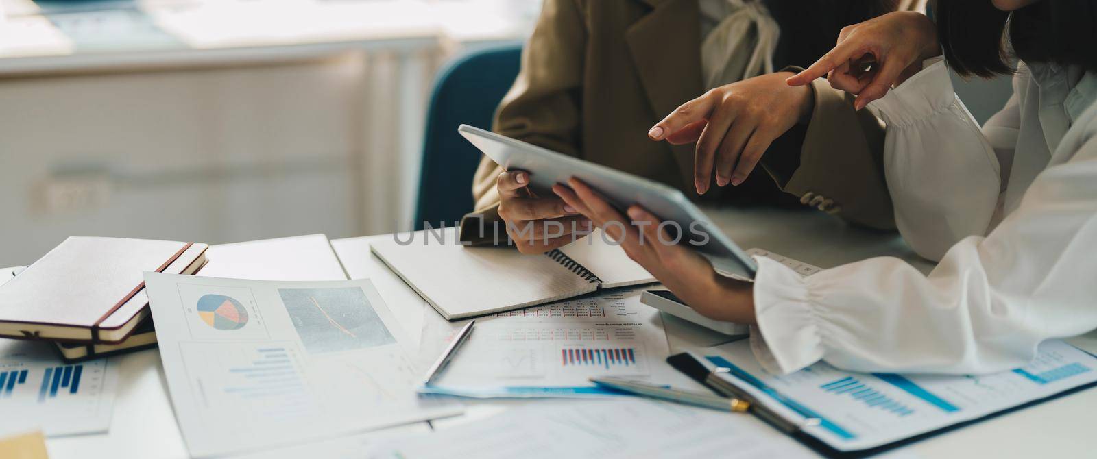 Group of business people busy discussing financial matter during meeting. Corporate Organization Meeting Concept.