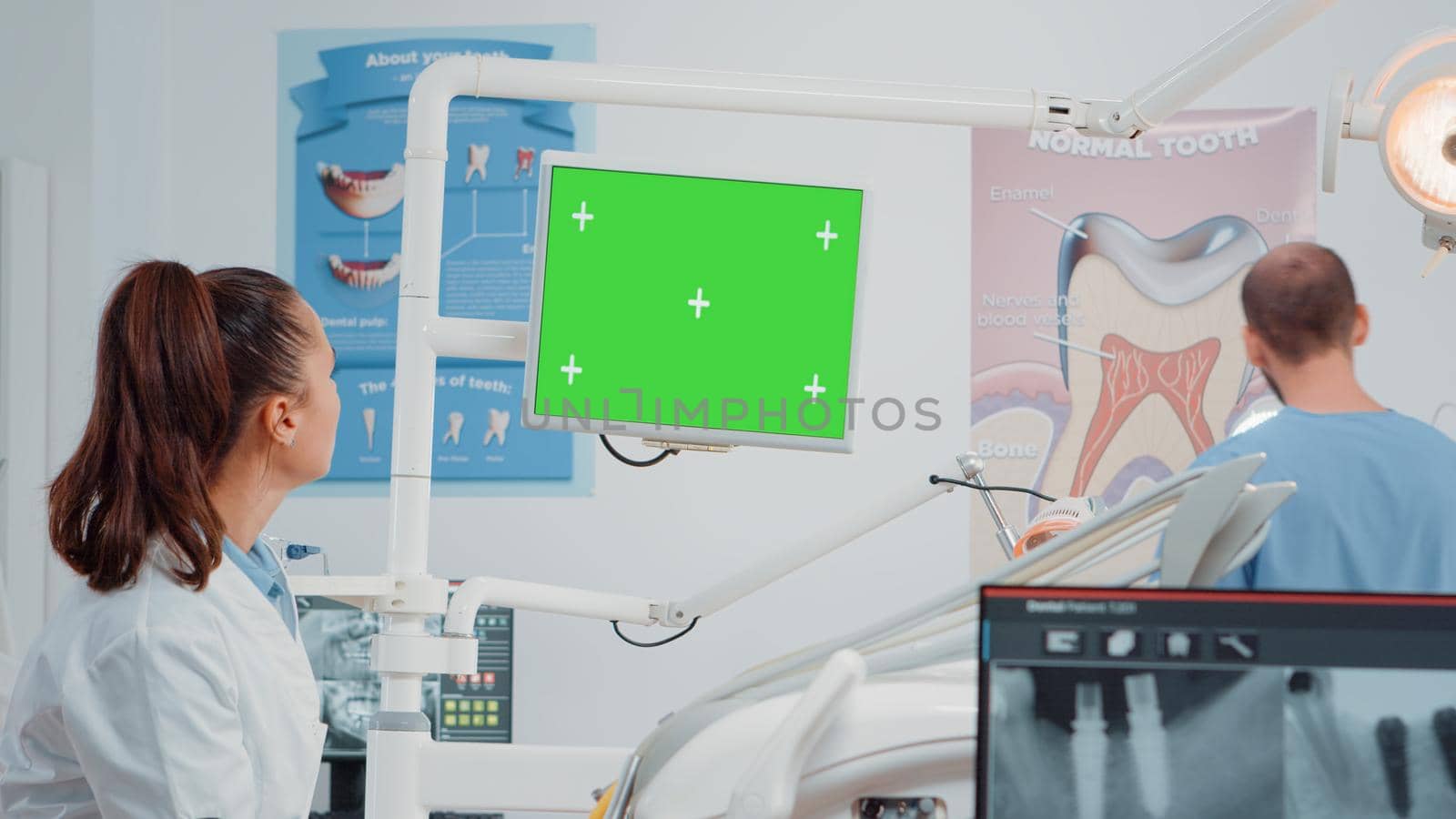 Dental team working with green screen on computer by DCStudio