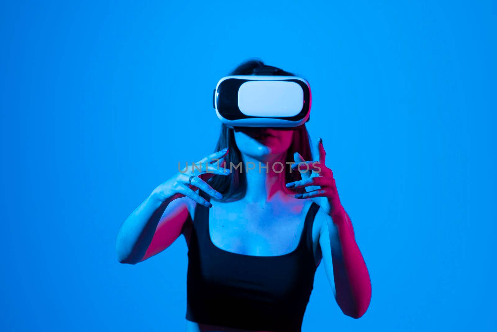 Female engineer wearing virtual reality headset designing a new pruducts or technologis using VR technology. Development and prototyping software