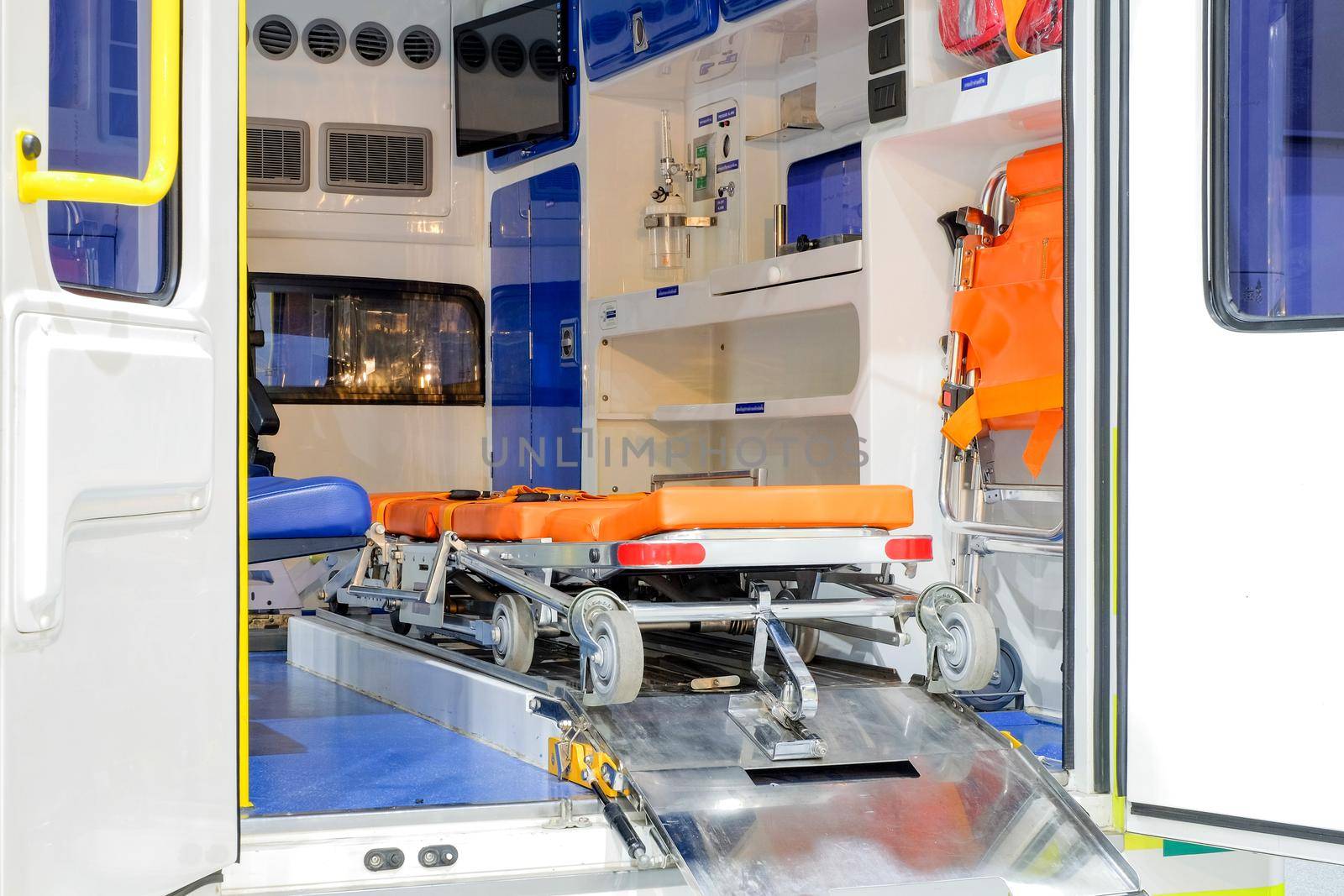 Inside an ambulance with medical equipment for helping patients before delivery to the hospital