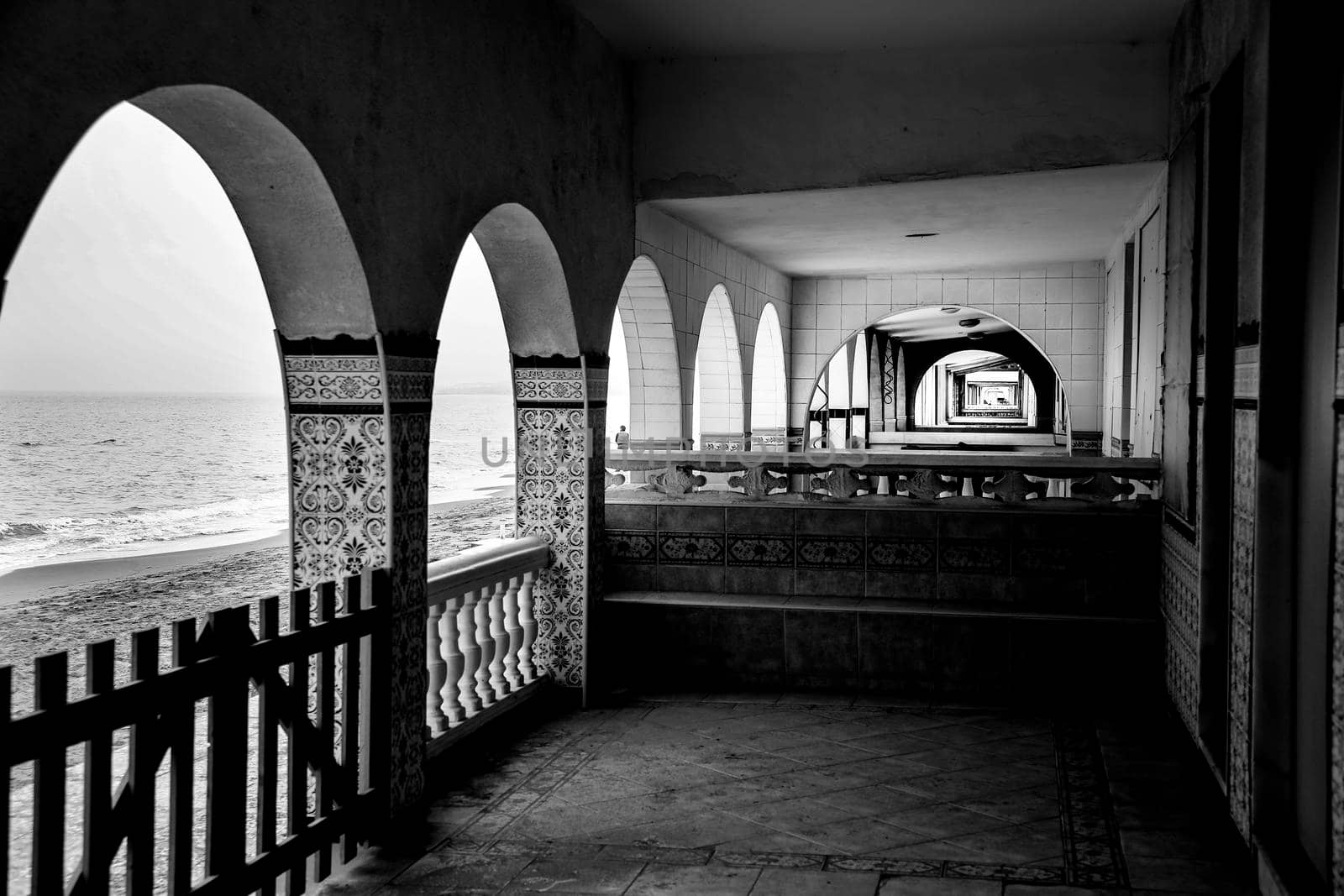 Architectural details of white typical spanish houses on the shore in Alicante, Spain. Monochrome picture.