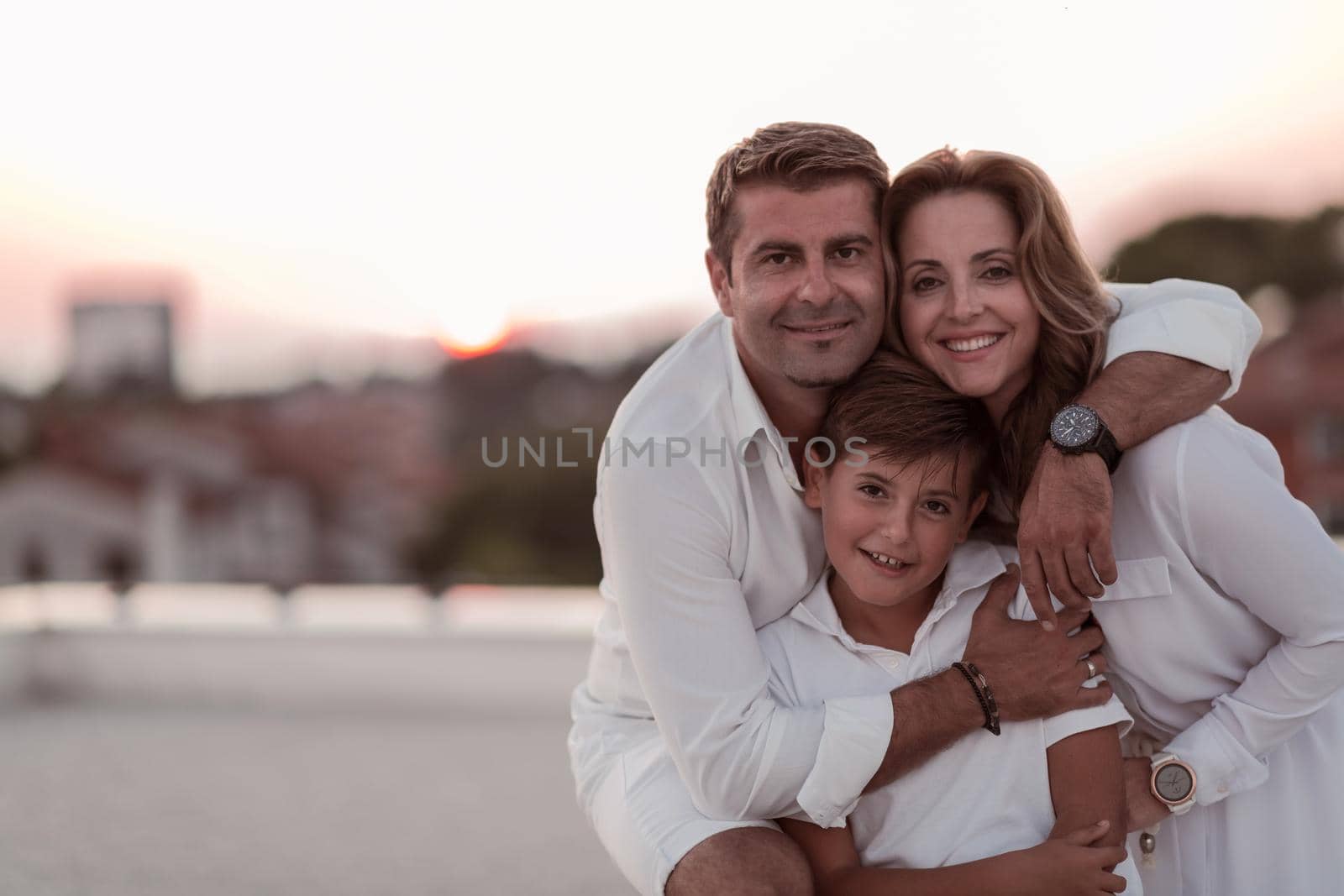 The happy family enjoys and spends time together on the roof of the house. Selective focus. High-quality photo