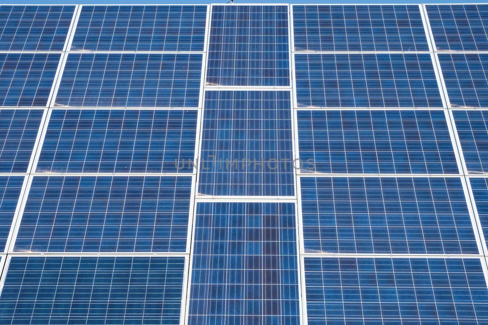 Solar panel, battery renewable energy on sky background by Fischeron