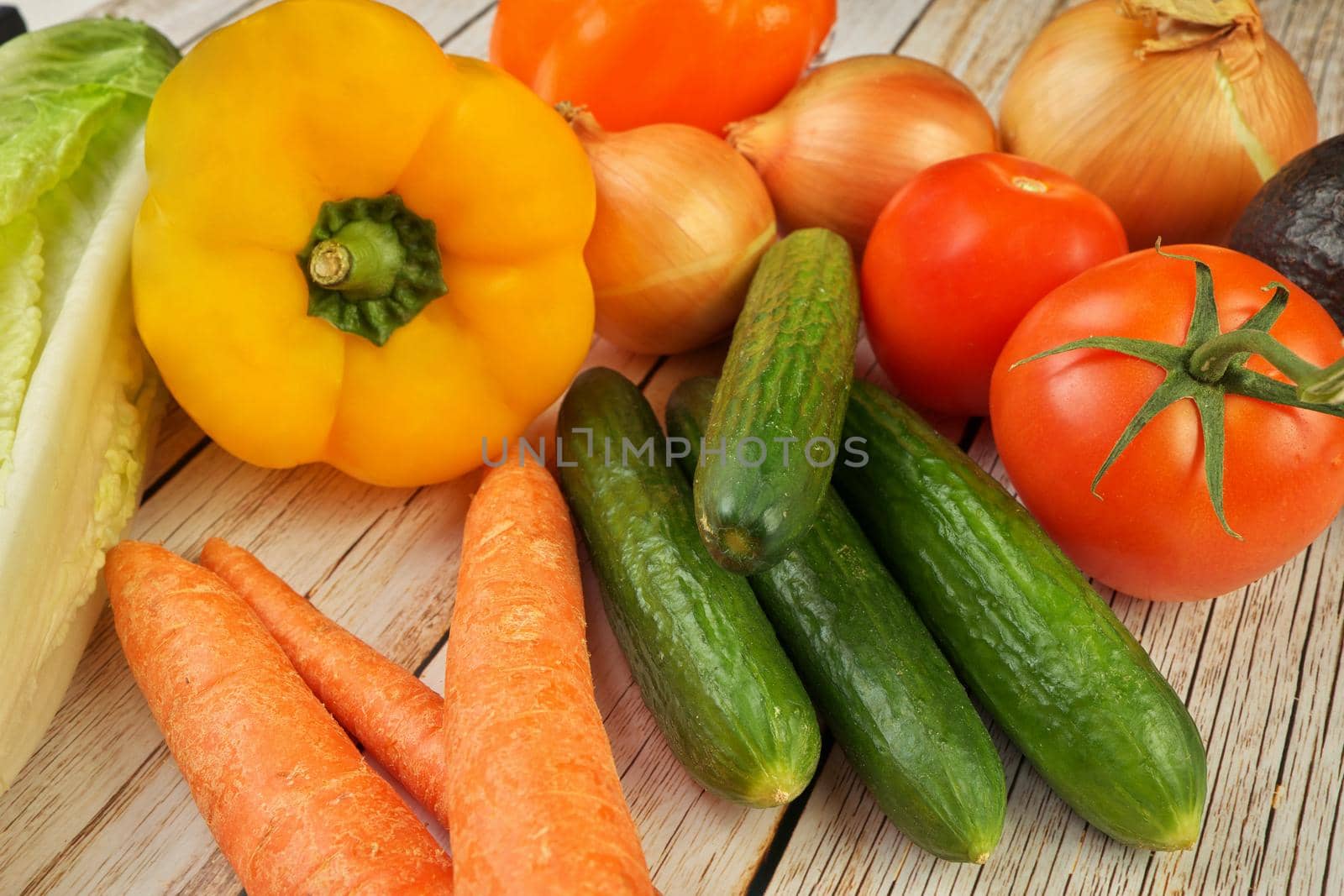 High Angle View of Selection of Fresh Summer Vegetables on a Rustic Wooden Table by markvandam