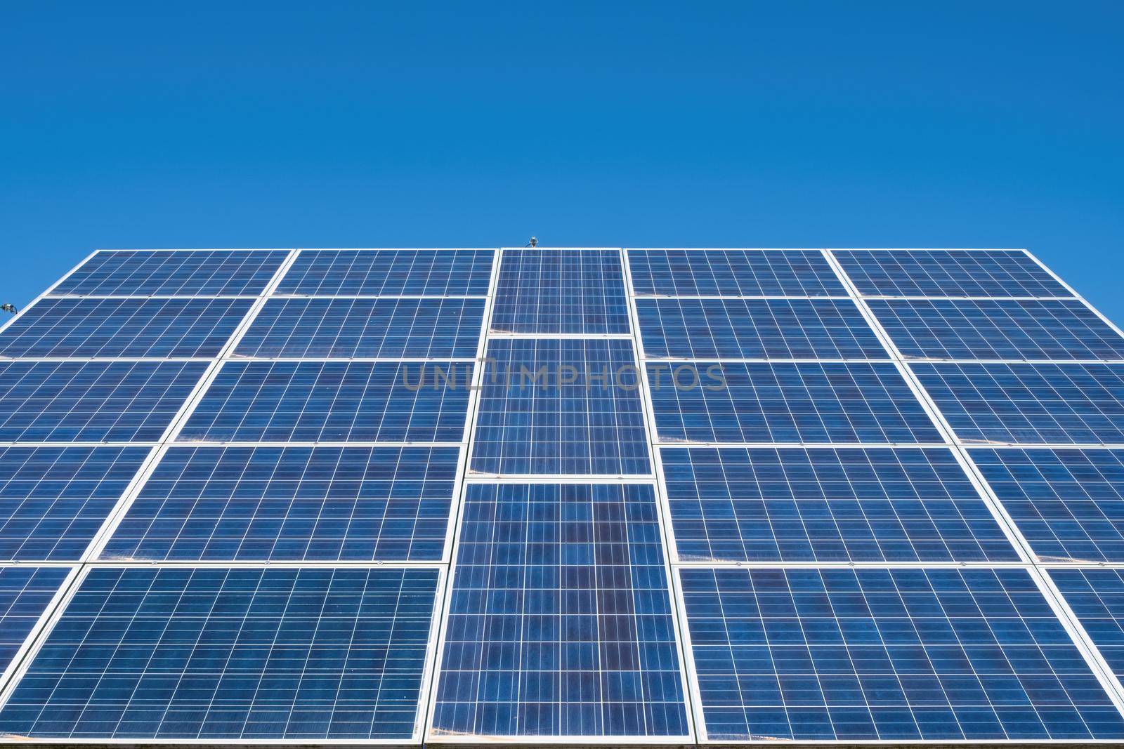 Solar panel, battery renewable energy on sky background by Fischeron