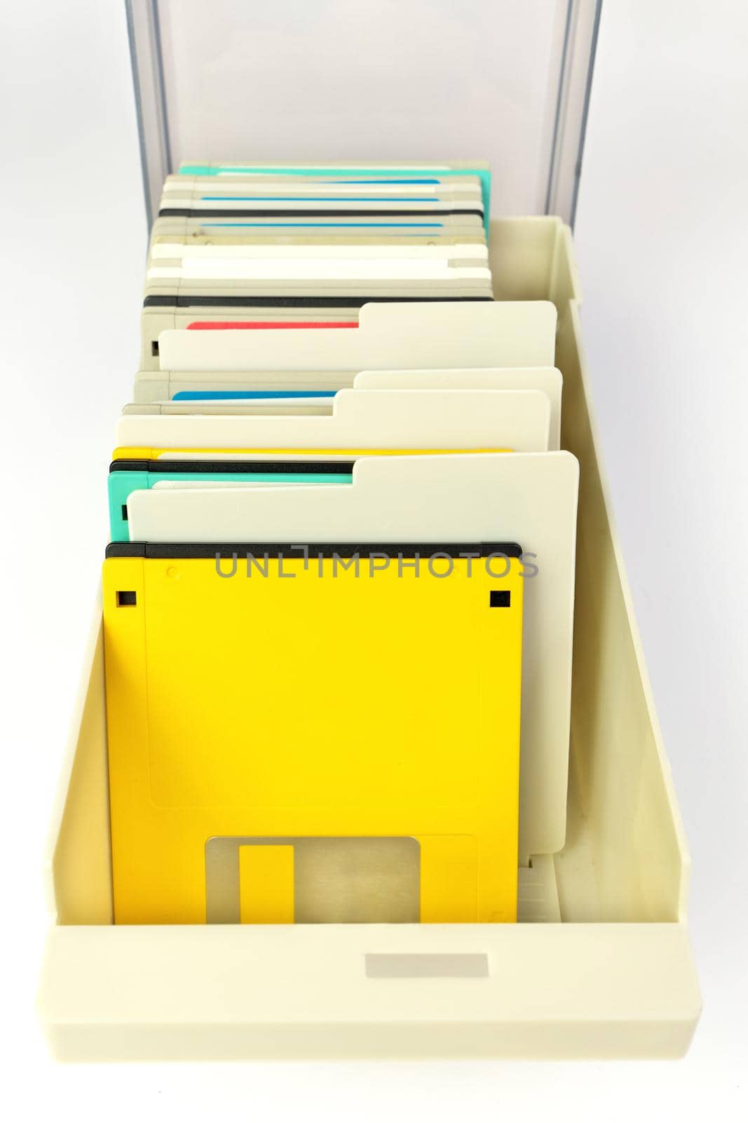 High Angle Close up of a Storage Box Full of 3.5 Inch Floppy disks for background. Retro digital storage technology.