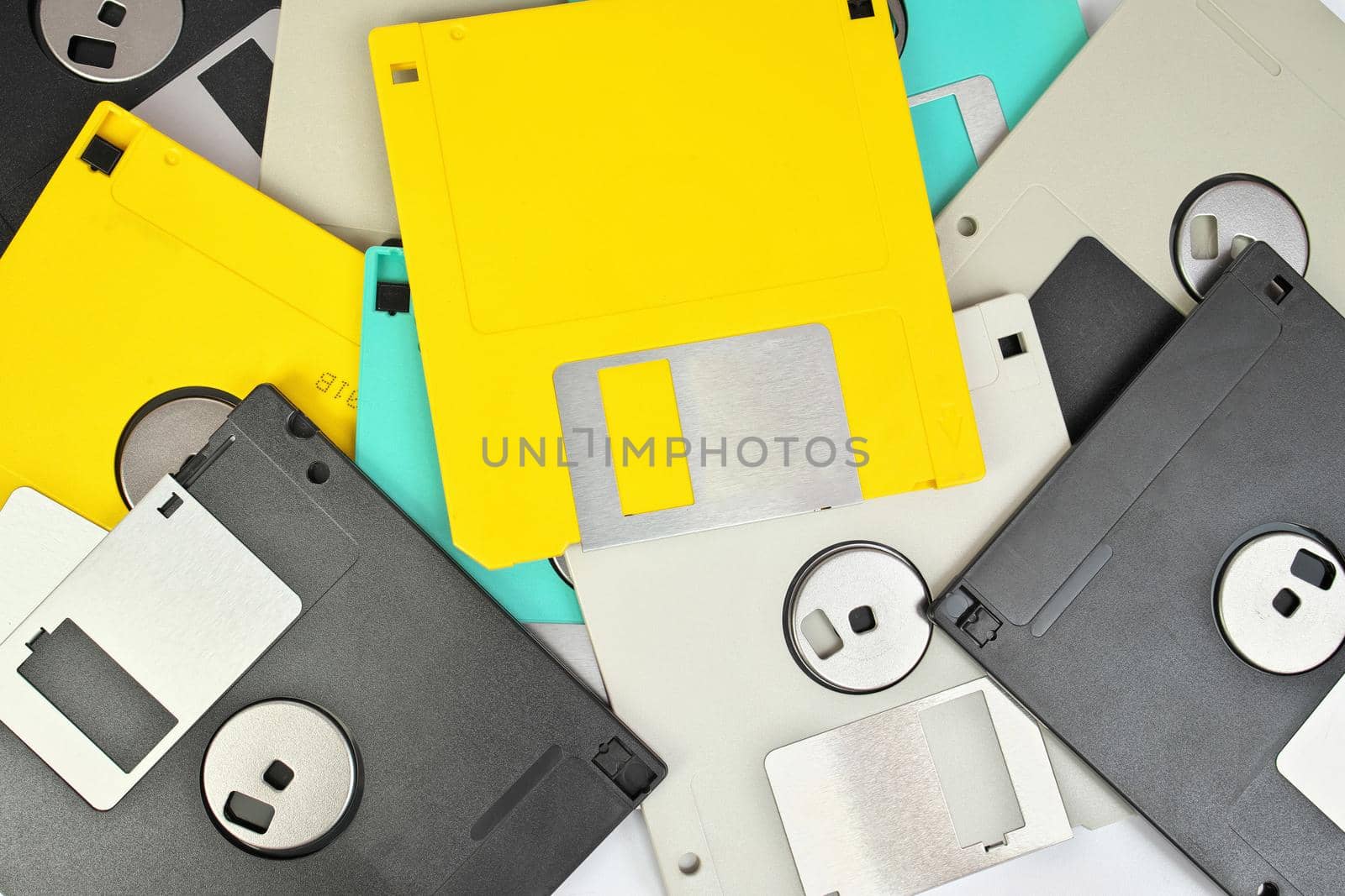 Directly Above Full Frame Close up of 3.5 Inch Floppy disks for background. Retro digital storage technology.