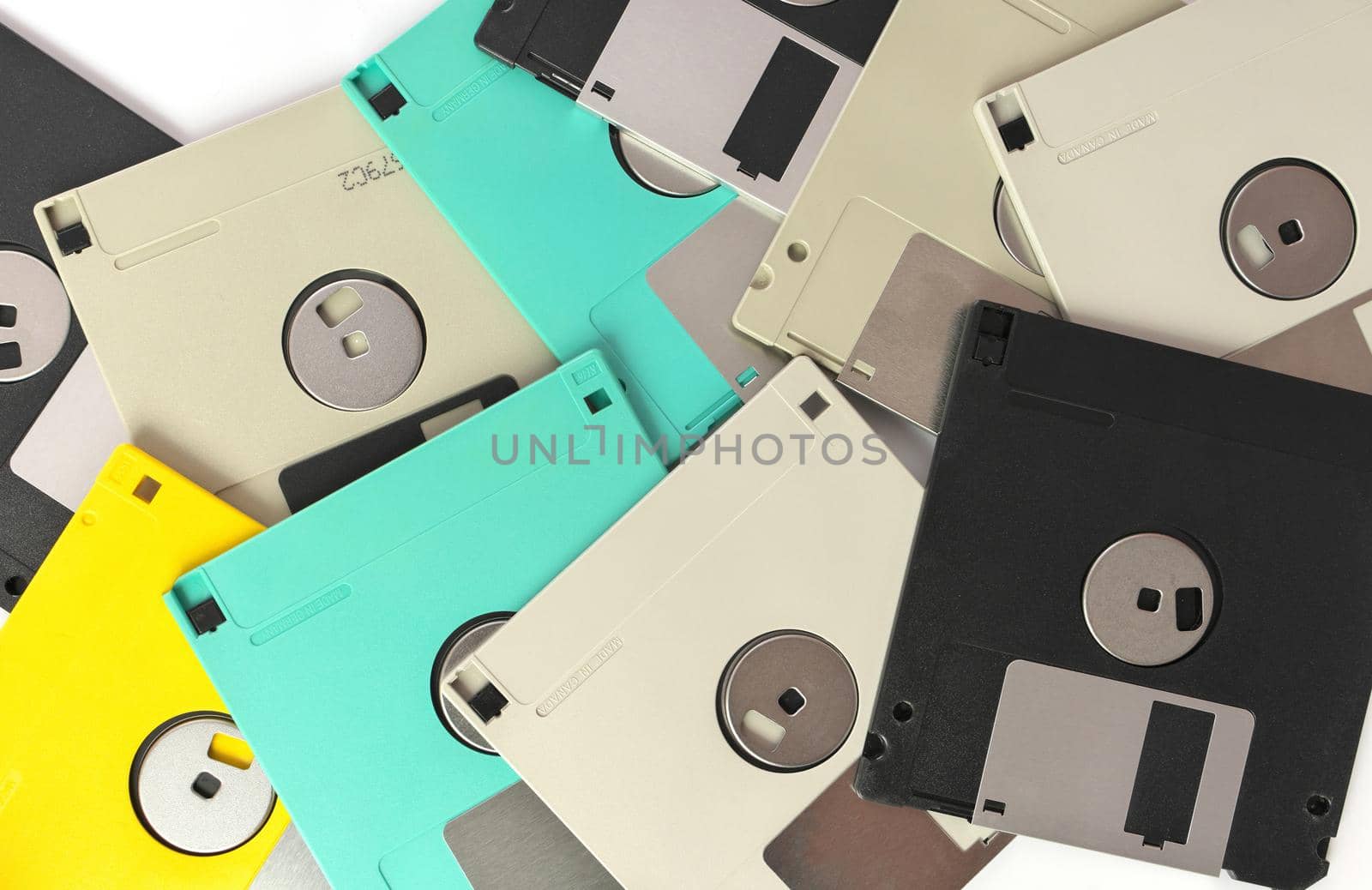 Full Frame Close up of 3.5 Inch Floppy disks for background. Retro digital storage technology. by markvandam
