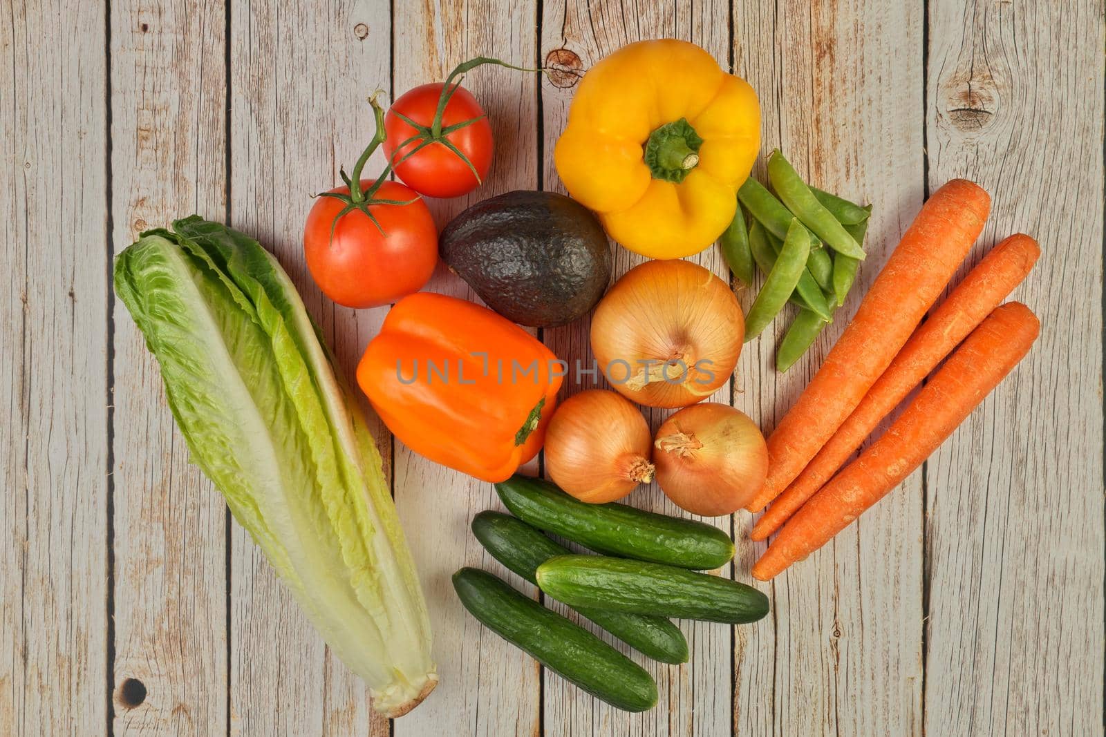 Directly Above Flat Lay View of a Variety of Fresh Summer Garden Vegetables on a Rustic Wooden Table