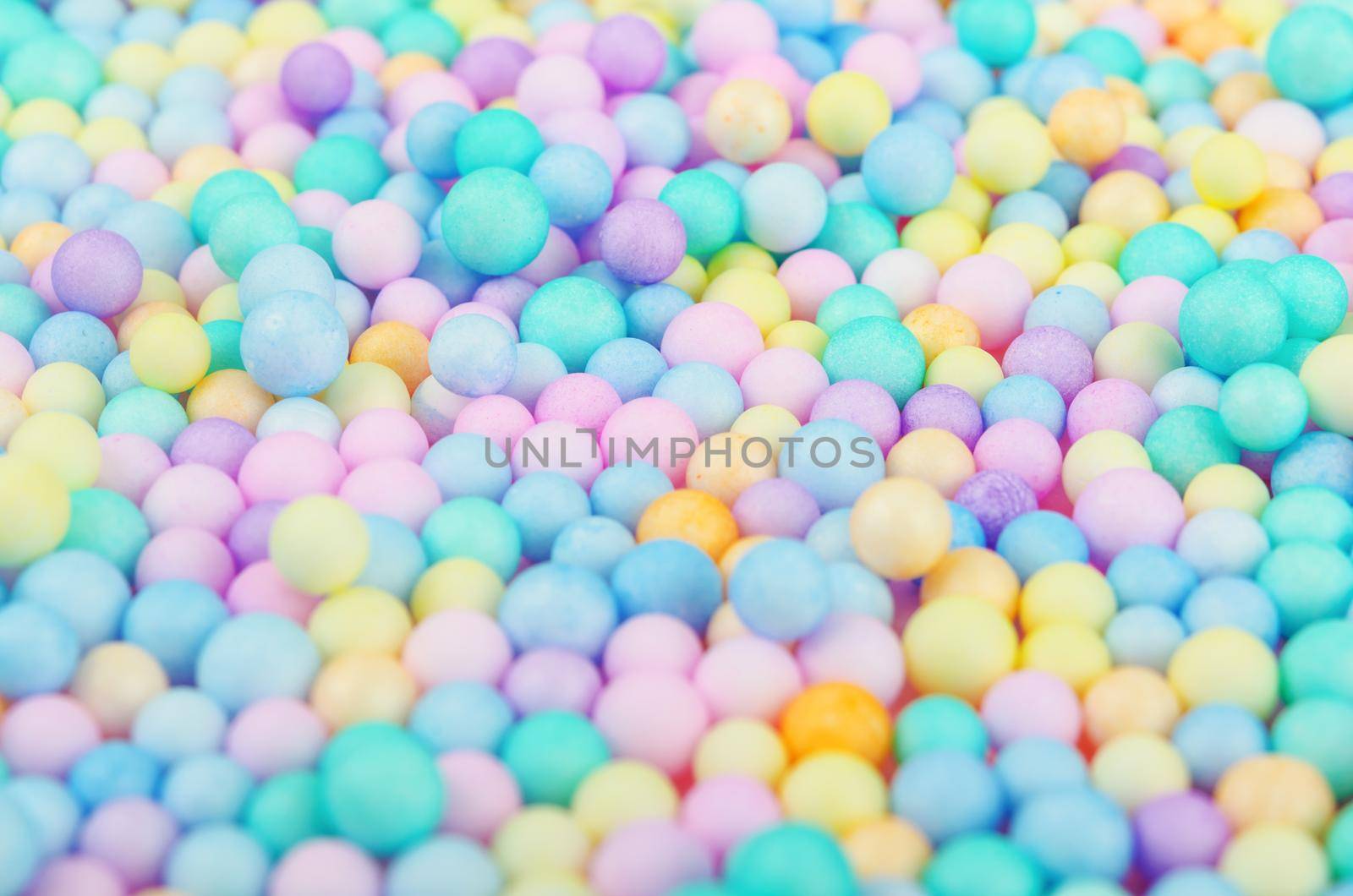 The Foam beads of various colors brightly colored abstract background.