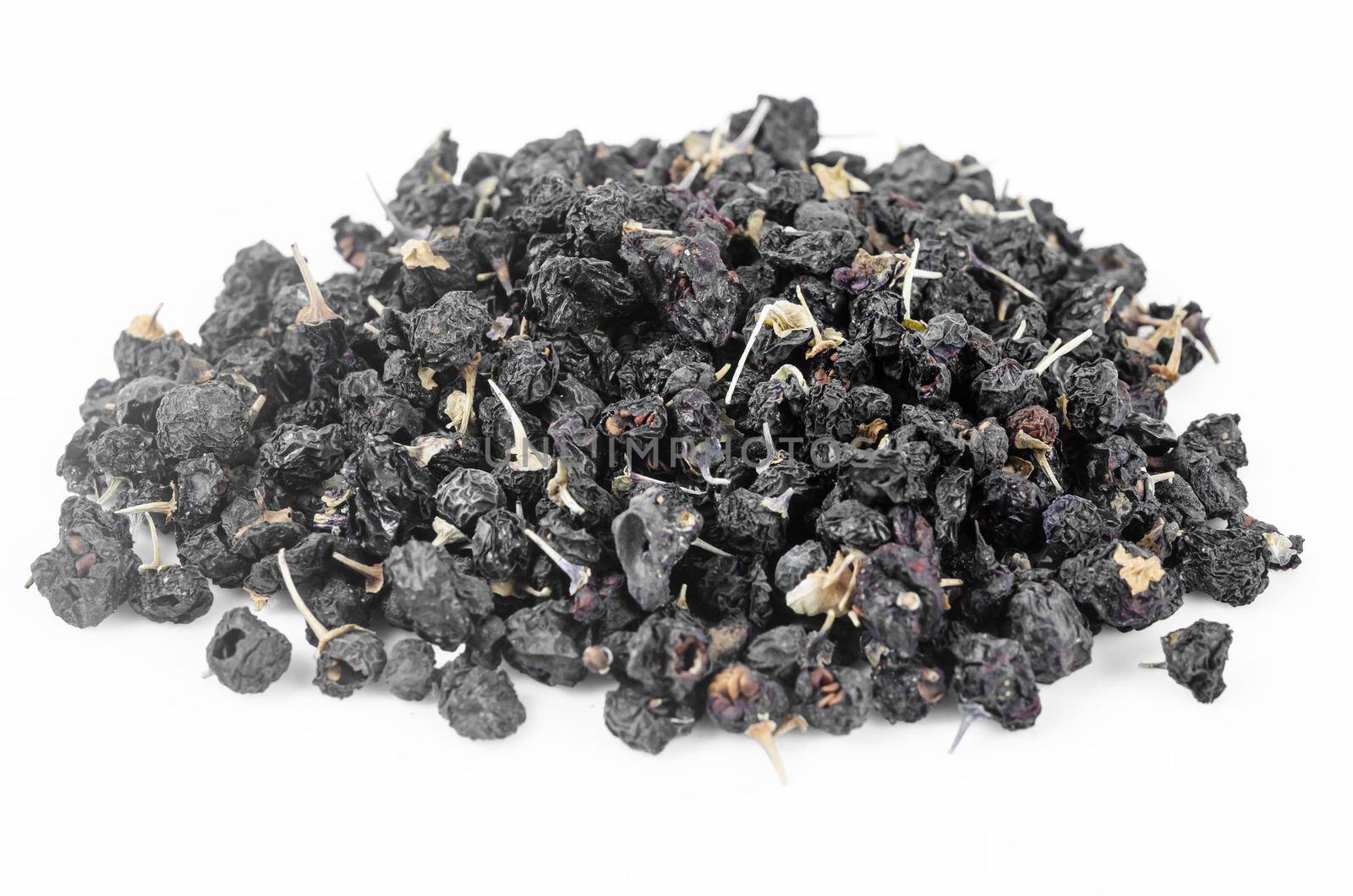 The Black wolfberries or black goji berries heap on white background.