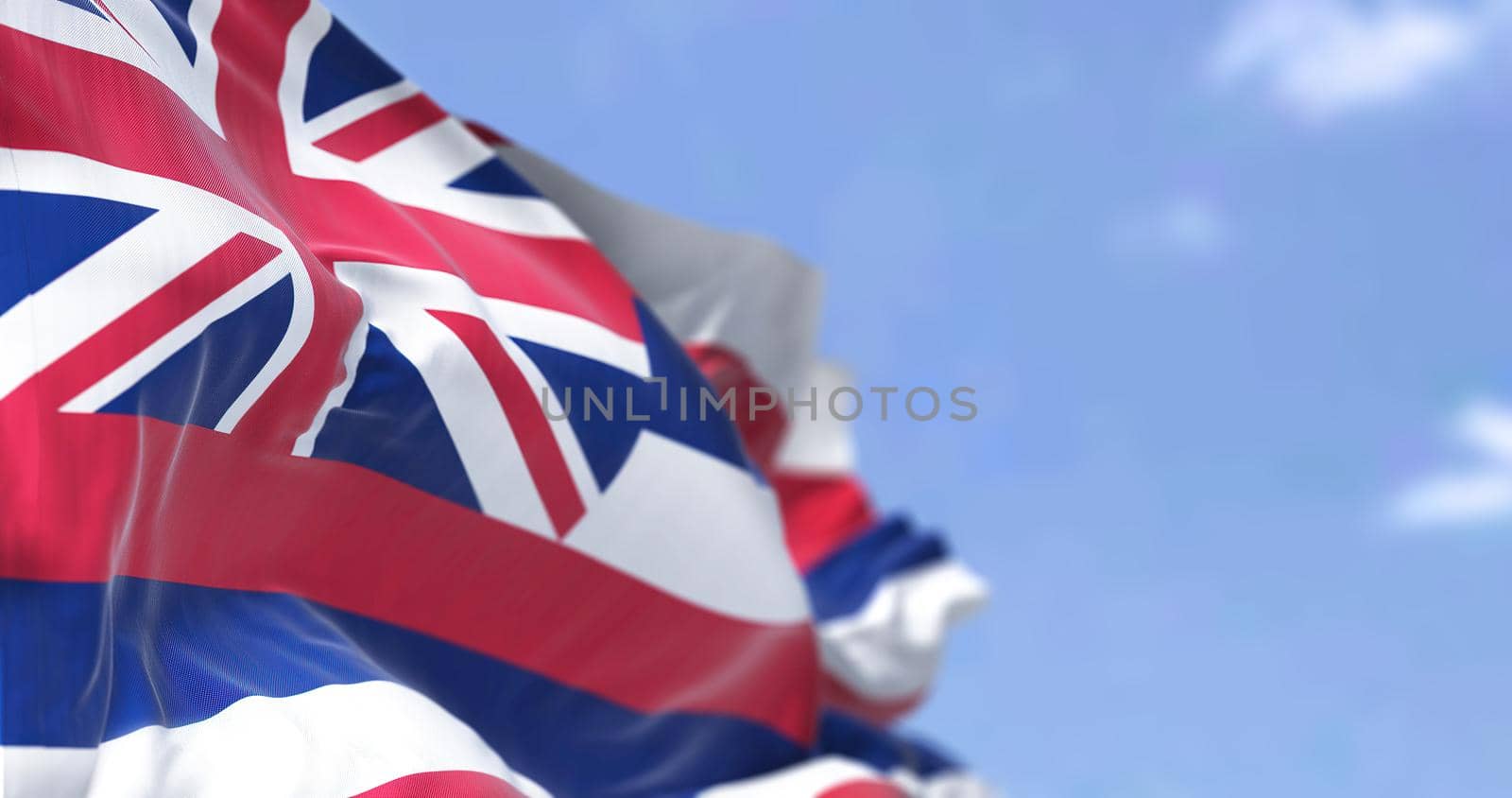 The state flag of Hawaii waving in the wind. Hawaii is a state in the Western United States. Democracy and independence.