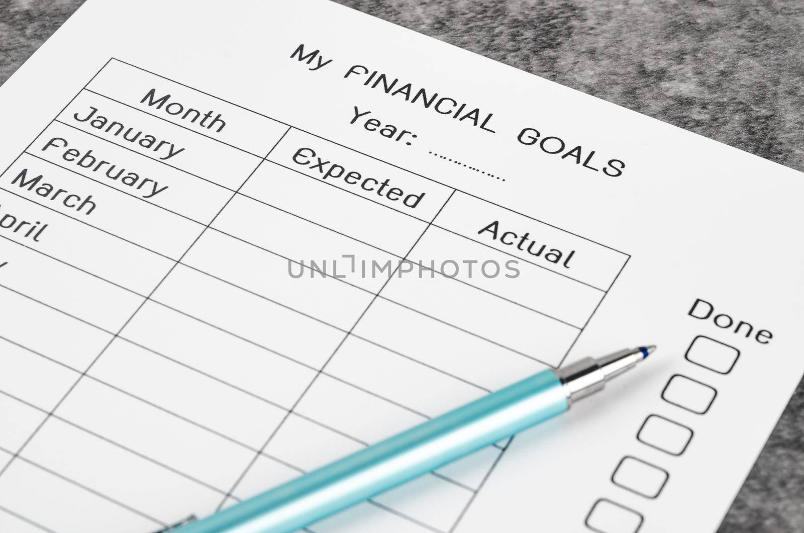 My planning financial goals form and pen.