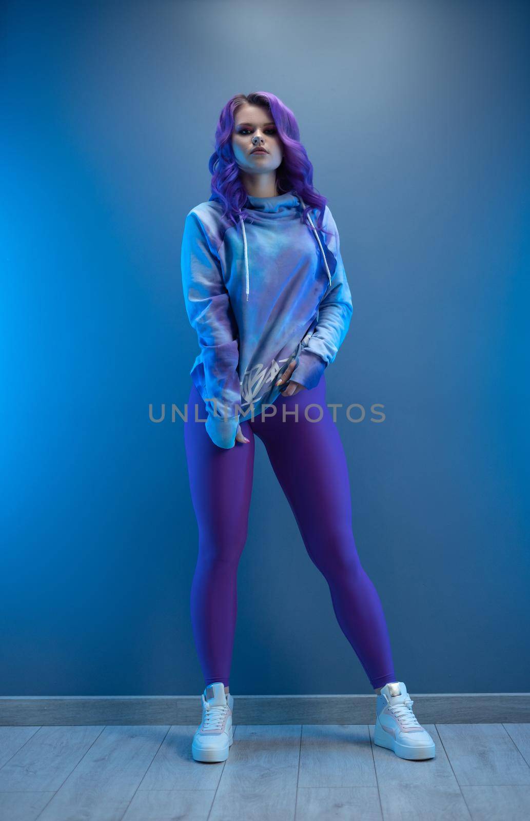 a girl in stylish purple sportswear and with purple hair poses sexually by Rotozey