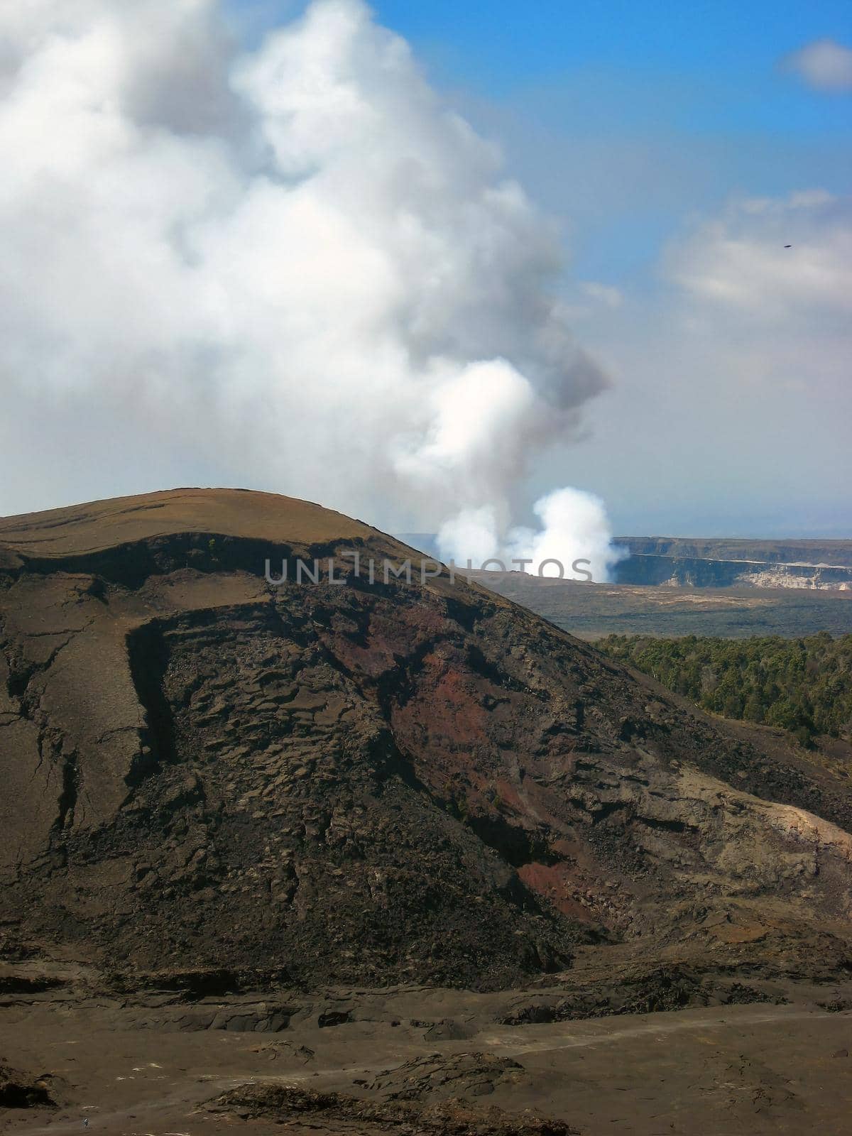 Smoking Crater of Halemaumau Kilauea Volcano in Hawaii Volcanoes National Park on Big Island with lava dome in foreground. High quality photo