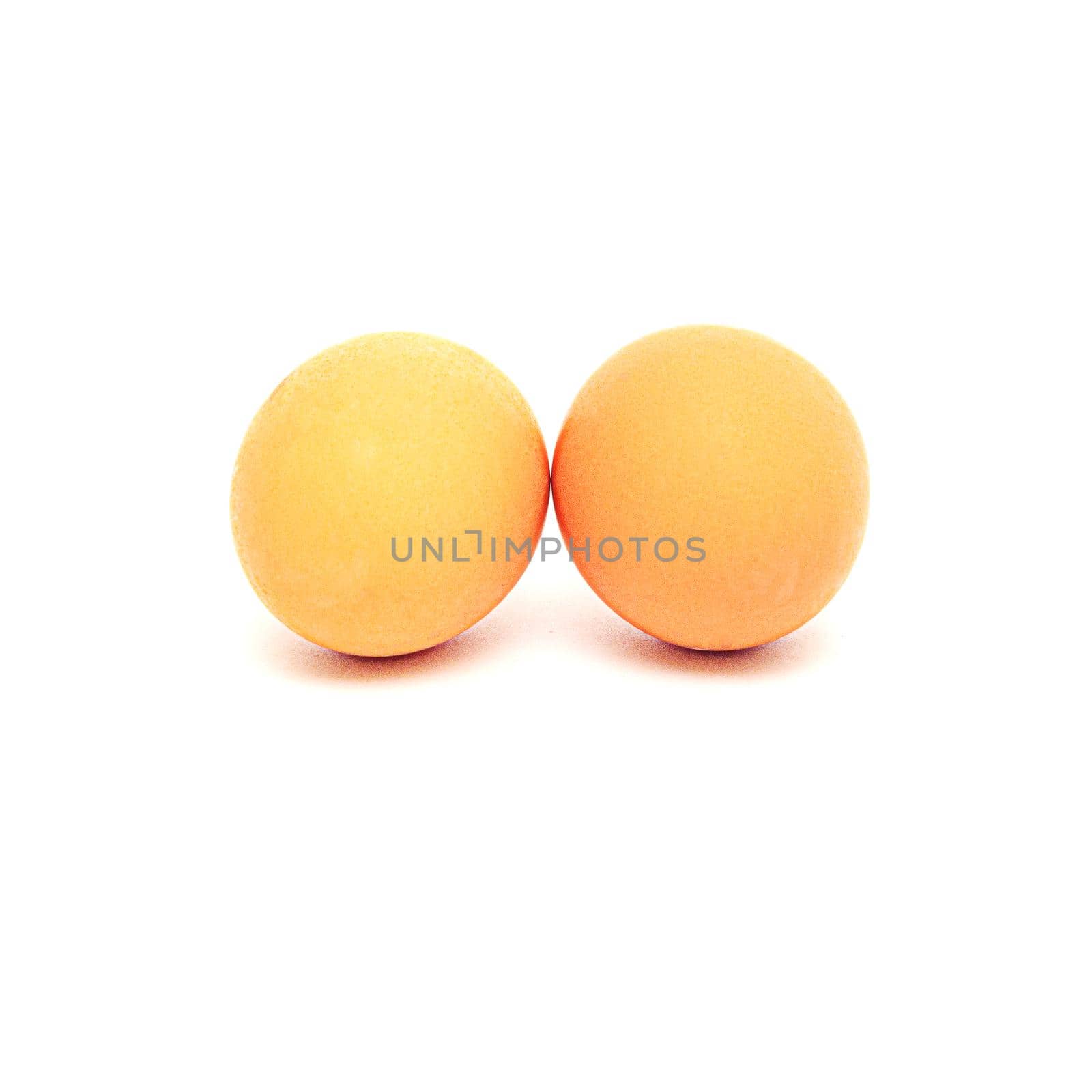 two yellow eggs isolated on white background
