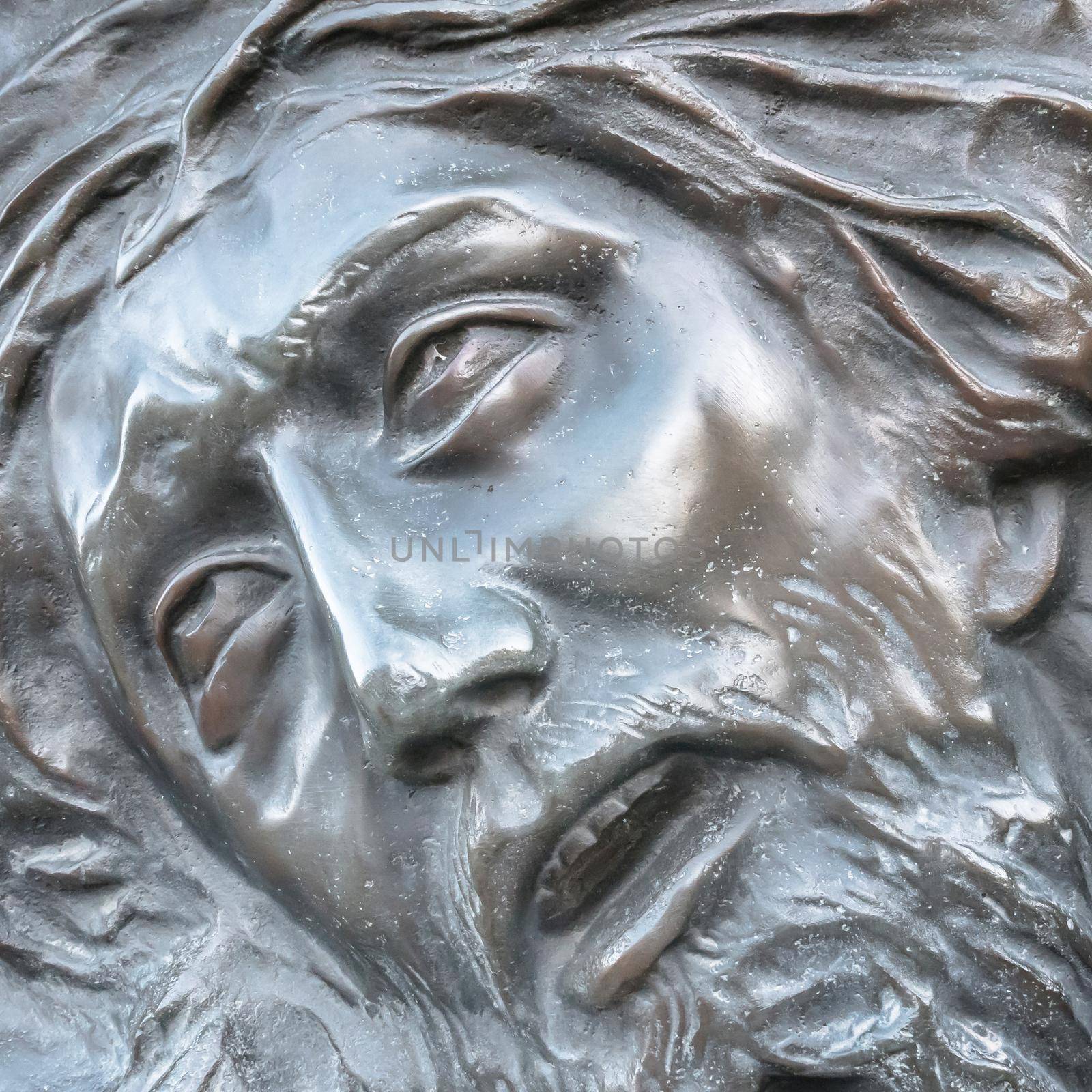 Bas-relief of Jesus crowned with thorns. High relief face of Jesus Christ with crown of thorns.