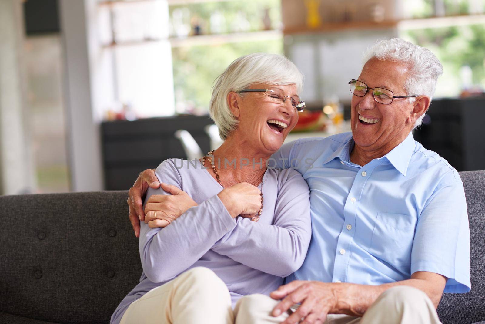 Shot of a senior couple enjoying each others company at home.