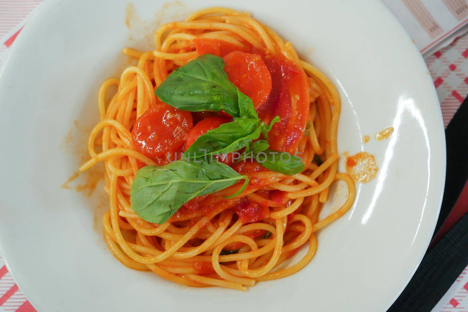 Italy, Campania, Naples, Restaurant, plate of pasta with tomato sauce , High quality photo