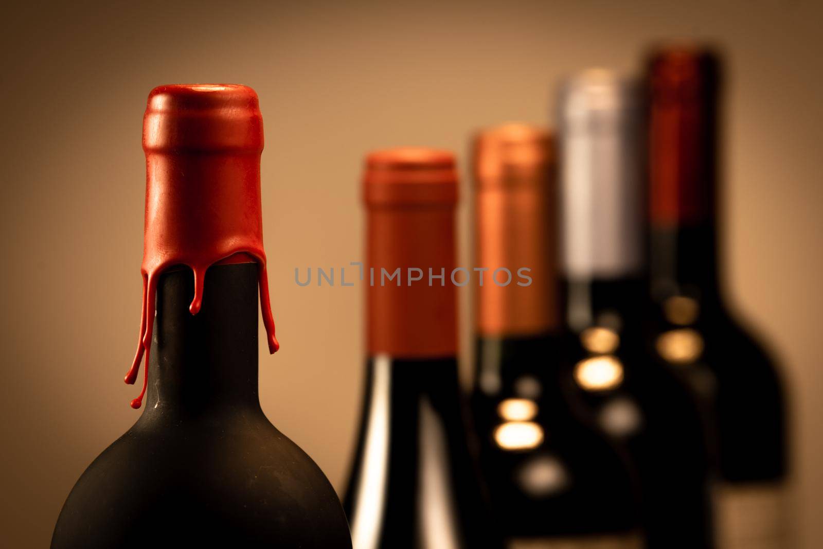 Set of collars red wine bottles isolated on black background, France