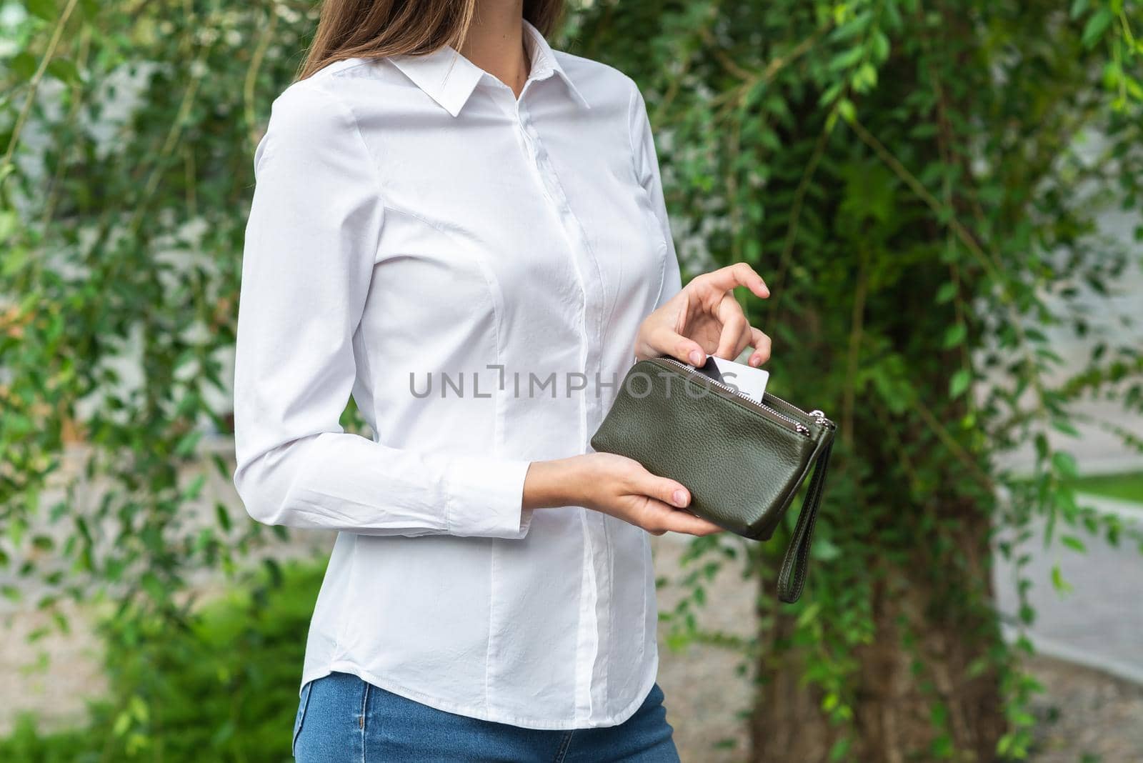 A girl holding a purse