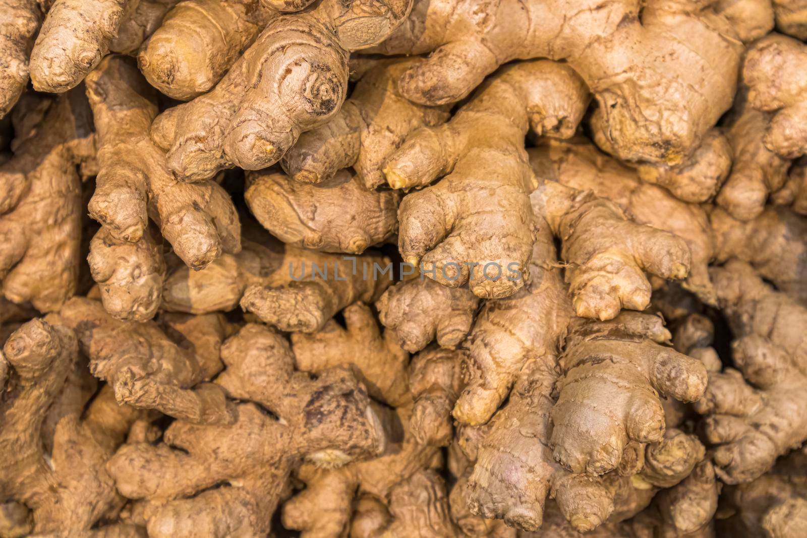 ginger root on the shelves in close-up as a background by roman112007