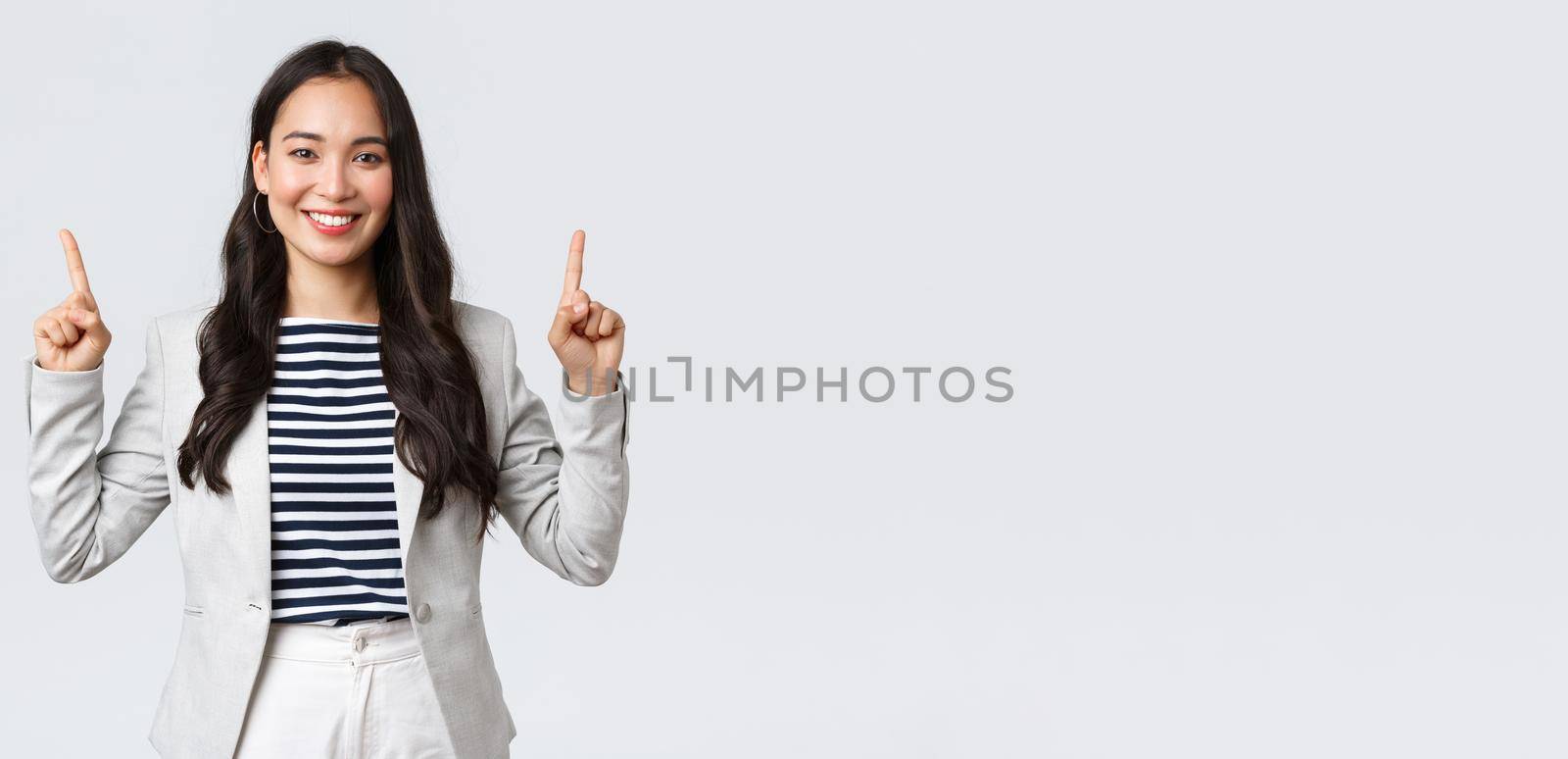 Business, finance and employment, female successful entrepreneurs concept. Successful confident smiling asian businesswoman pointing fingers up, real estate worker showing perfect proposal.