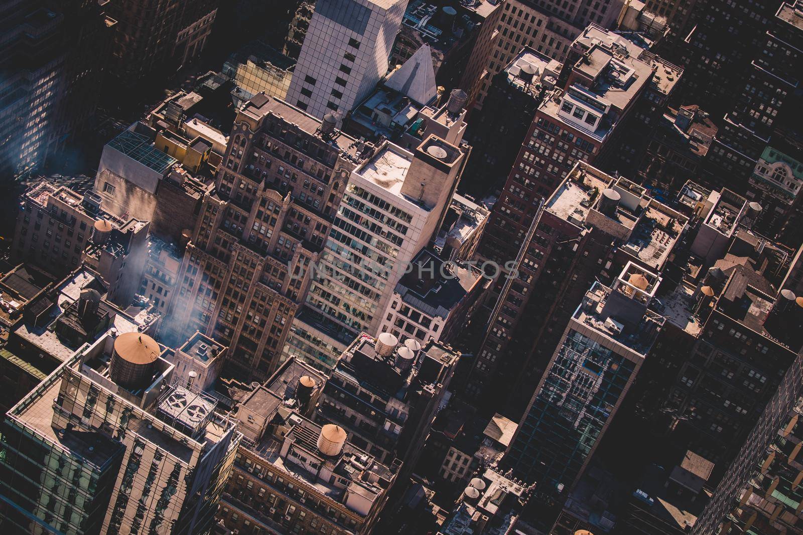 New York City, USA. Midtown Manhattan building rooftops with steam comming from the heating systems.