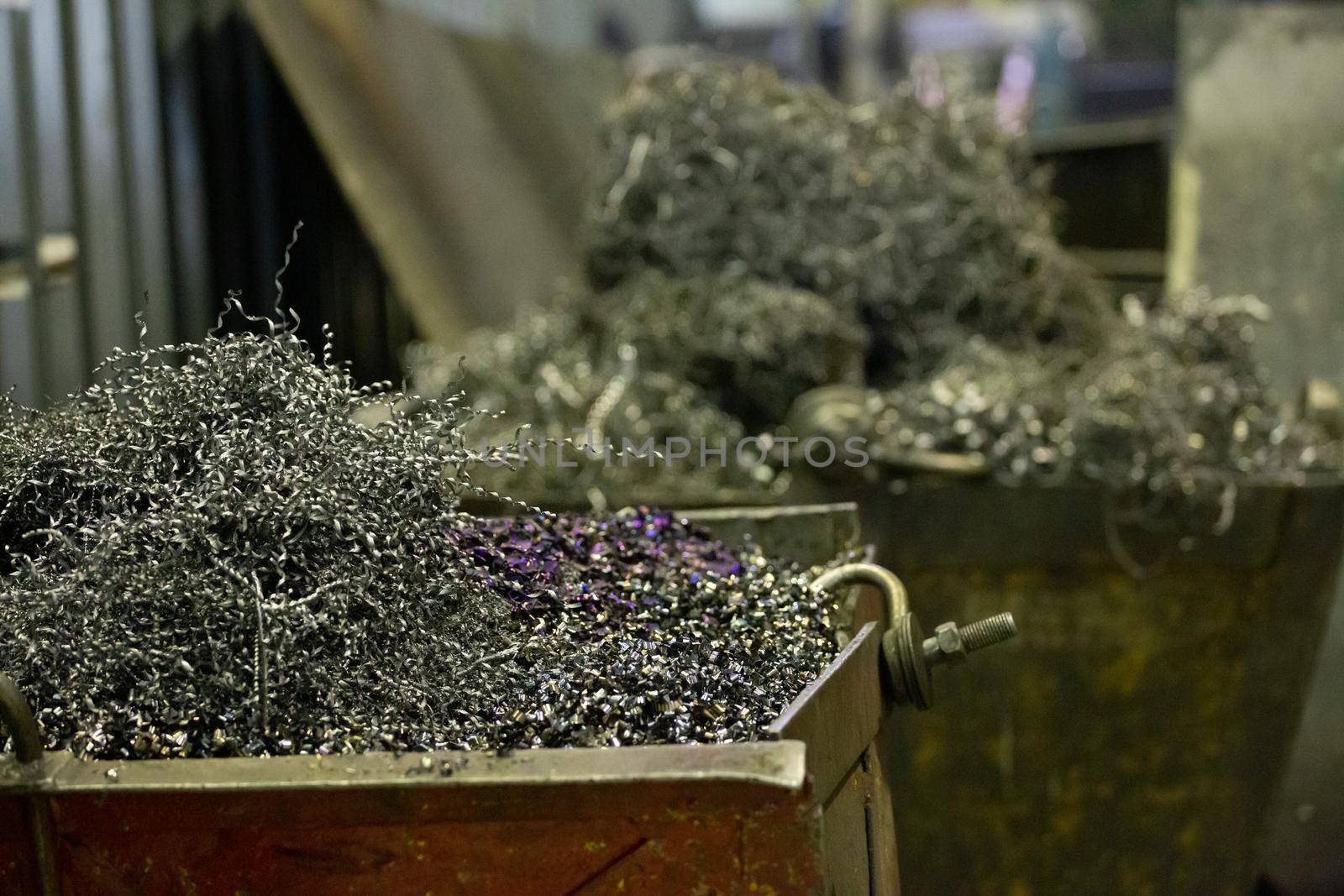big steel containers with steel swarf and fillings, close-up with selective focus