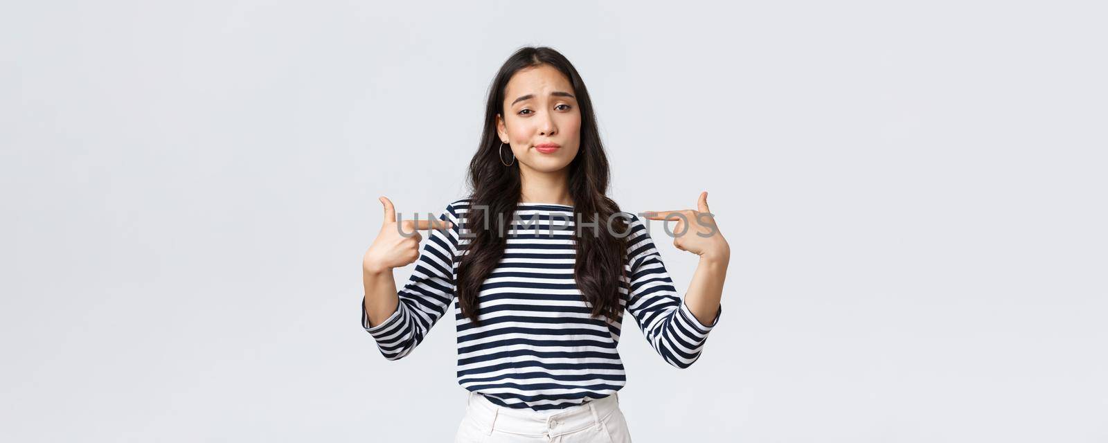 Lifestyle, beauty and fashion, people emotions concept. Confident young arrogant korean girl show-off, smirk cool and pointing herself at bragging personal achievement.