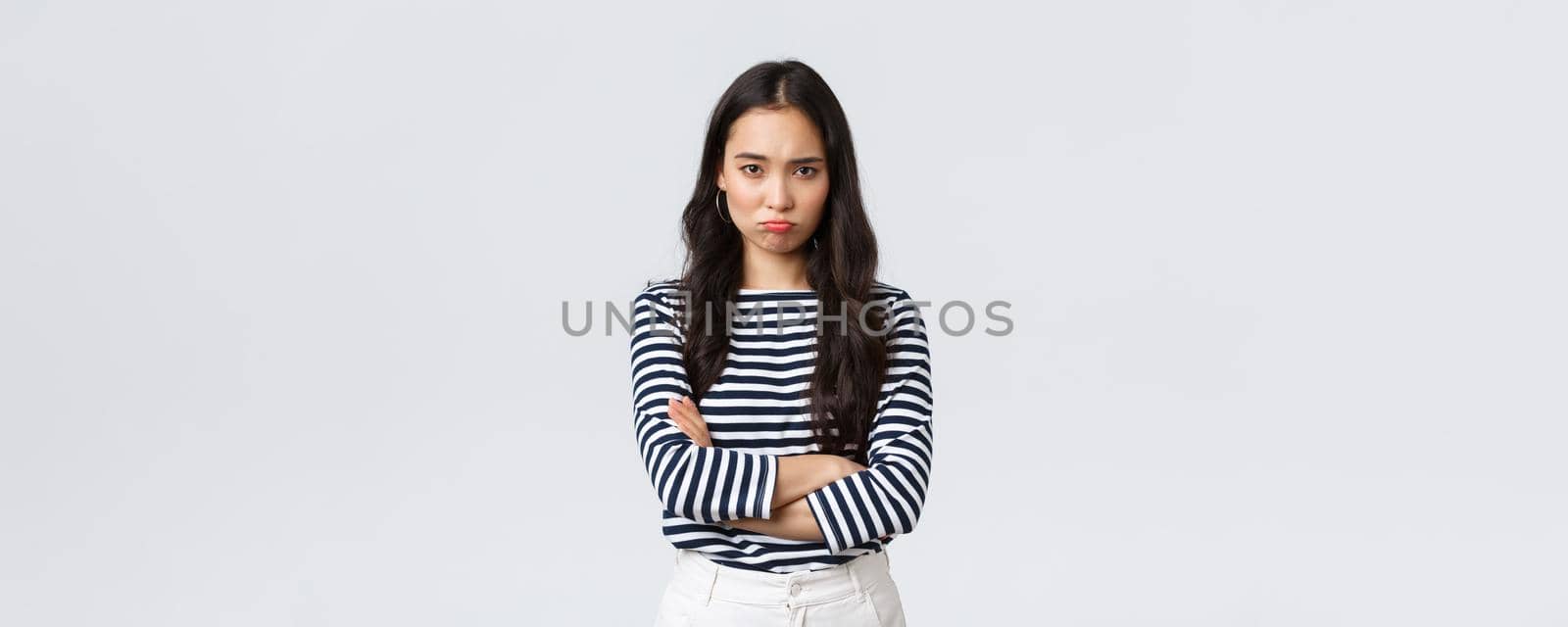 Lifestyle, people emotions and casual concept. Mad and offended cute silly asian girlfriend pouting, looking upset with hands crossed over chest, waiting for apology by Benzoix