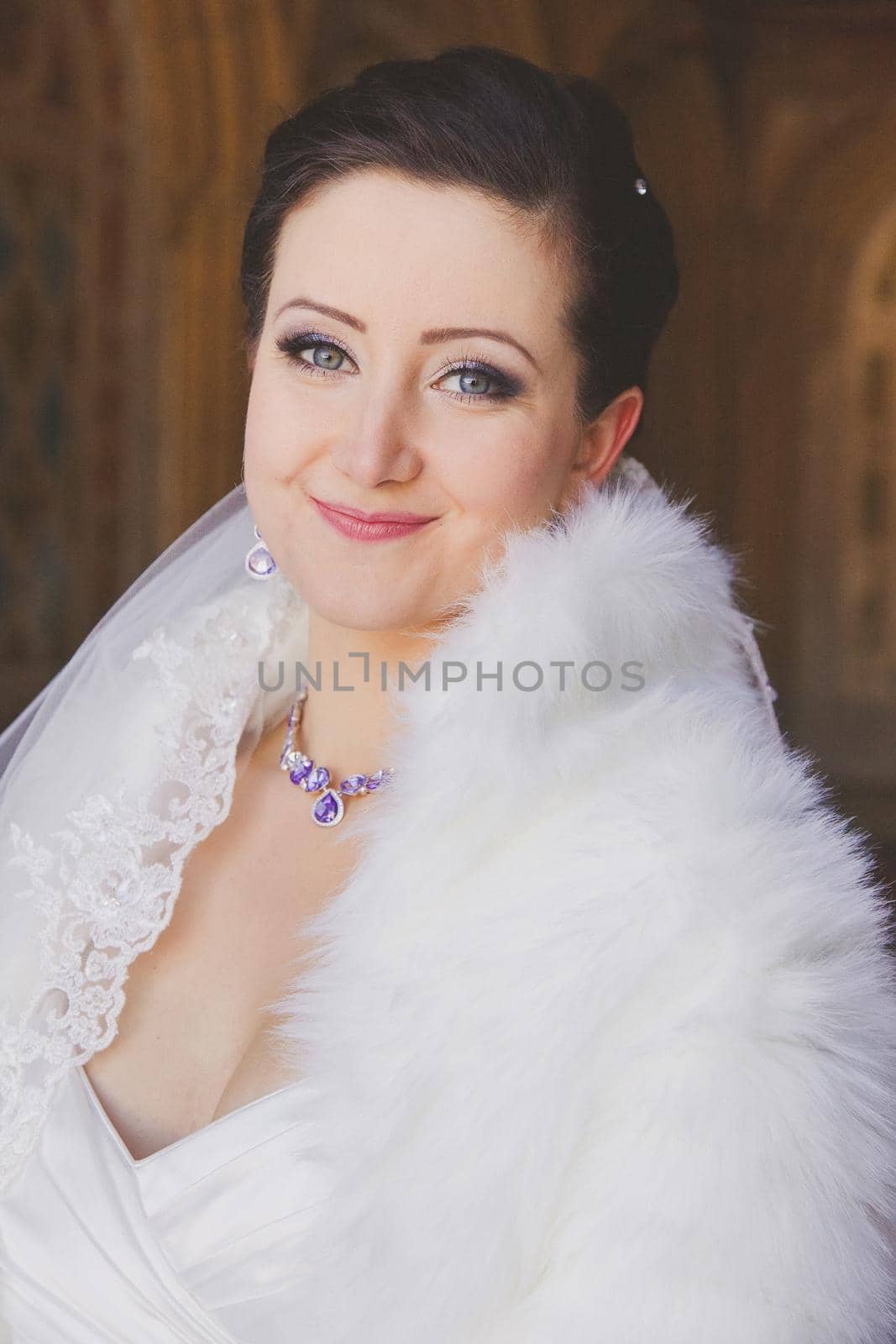 Beautiful bride in a fur cape with by ungvar