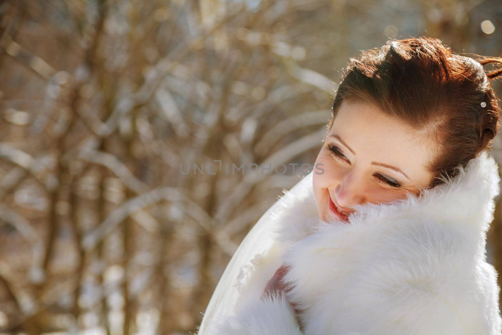 Bride in the park in winter by ungvar