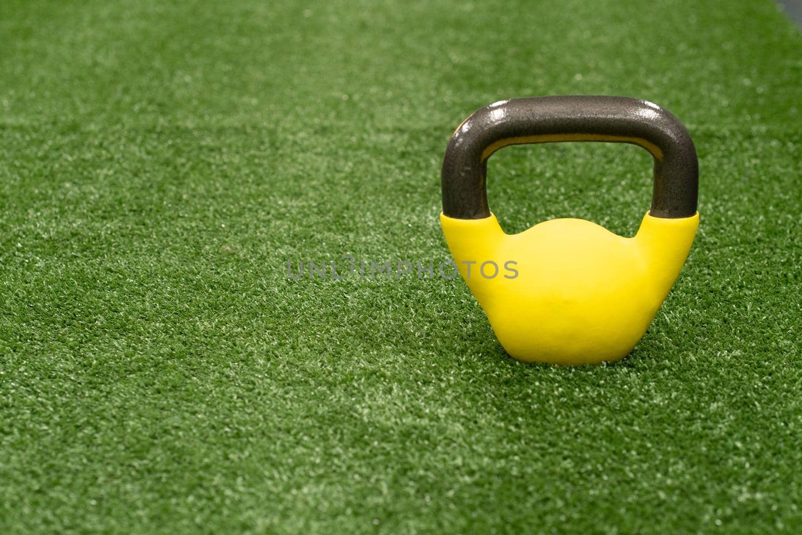 Yellow kettlebell weight background concept, from gym equipment in strong from health single, bright raining. Text pound fitness, ettlebell dumbbell black fresh black background object