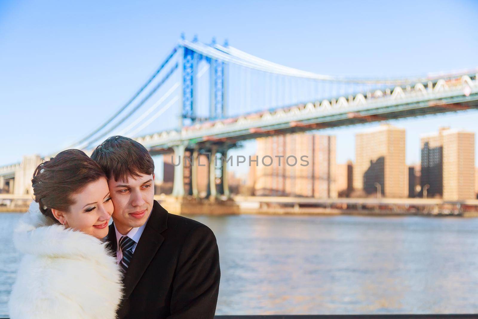 bride and groom on the background of Brooklyn Bridge by ungvar