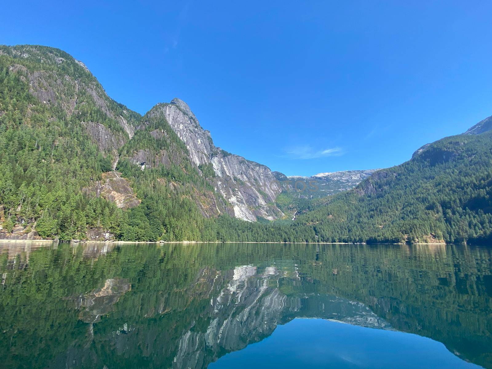 British Columbia Princess Louisa Inlet surrounded by high, rugged peaks of the Coast Mountains and beautiful water with endless blue skies by Granchinho
