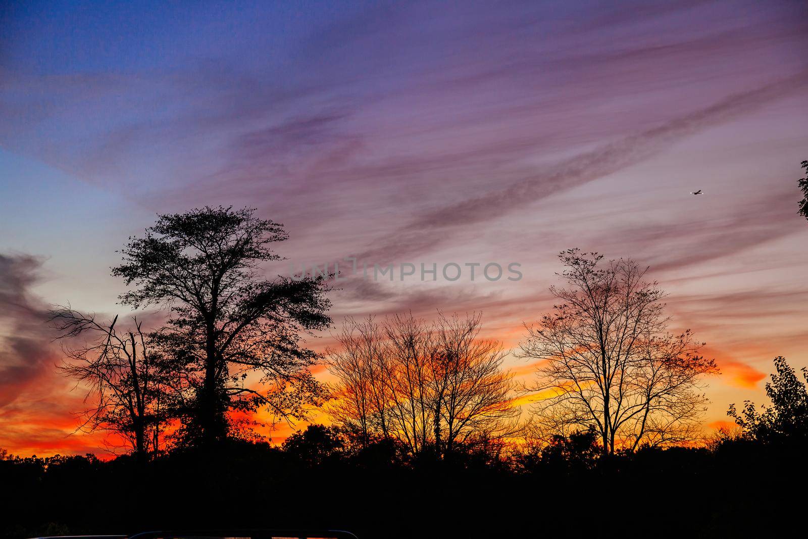 Bright colorful sunset on the sea with beautiful clouds by ungvar