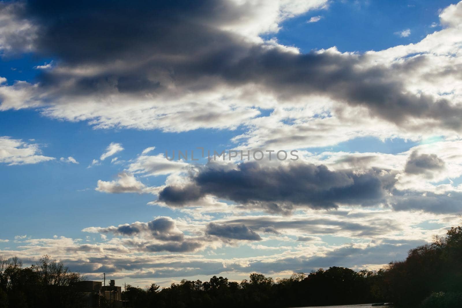 blue sky with clouds closeup by ungvar