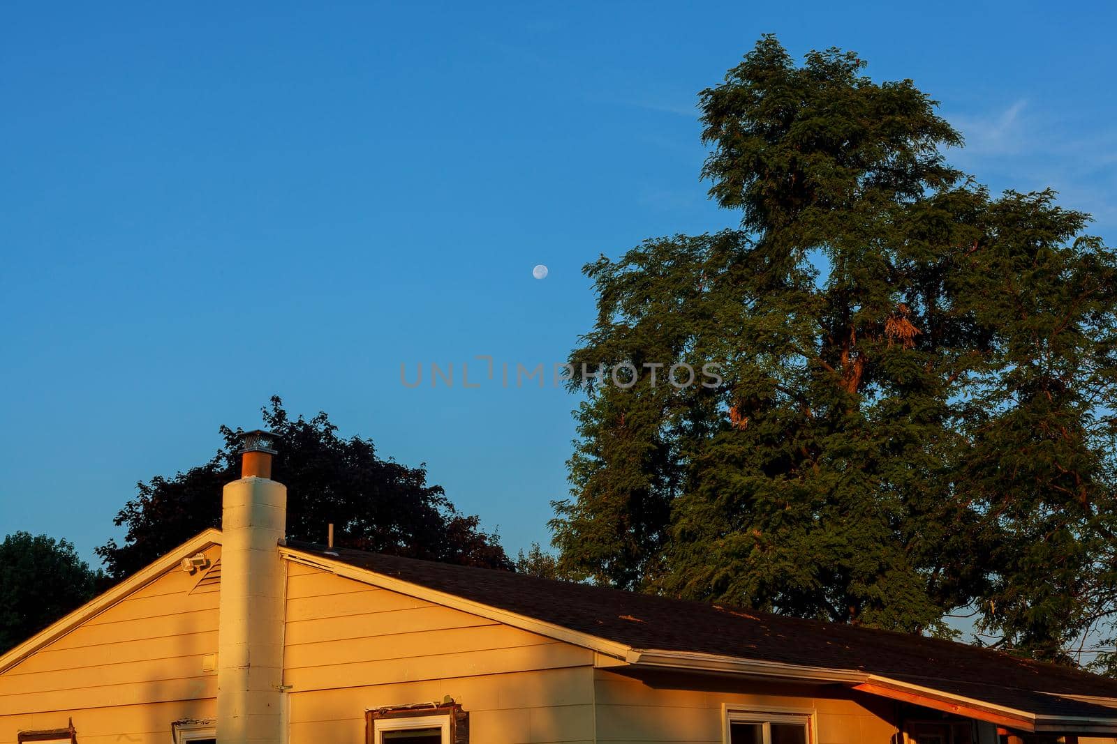 Beautiful blue sky and moon above the roof house moon house sky