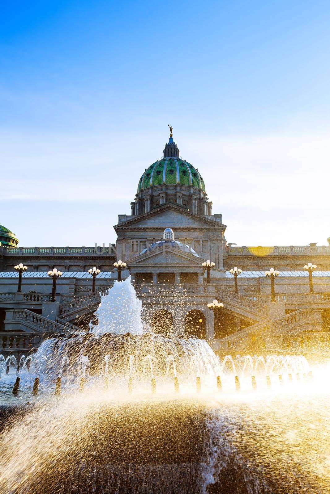 Pennsylvania capital building in Harrisburg. Back side of the with the fountain in the foreground. by ungvar