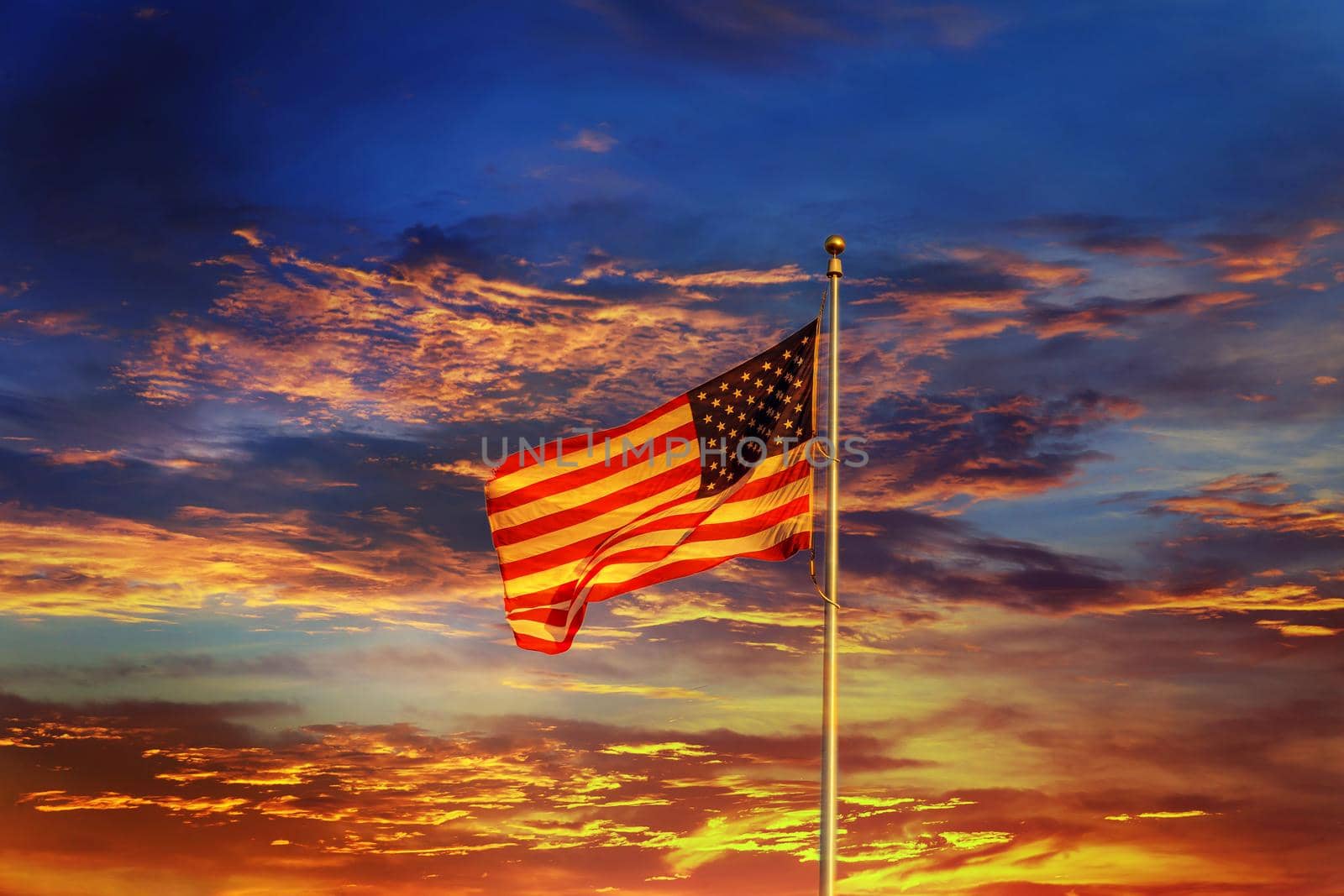 American flag in front of bright sky Night sunset red sky