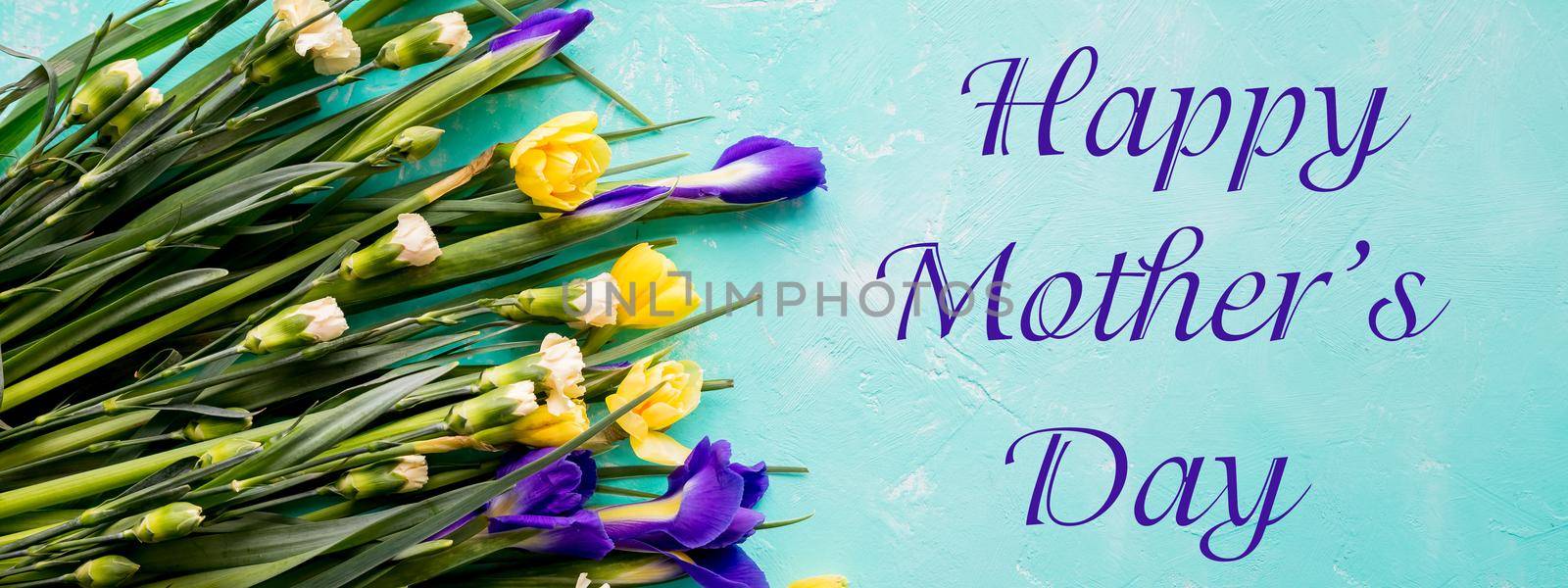 Happy Mother's Day.Bouquet of yellow Narcissus flowers and gift box .Spring flowers for Mother's Day.