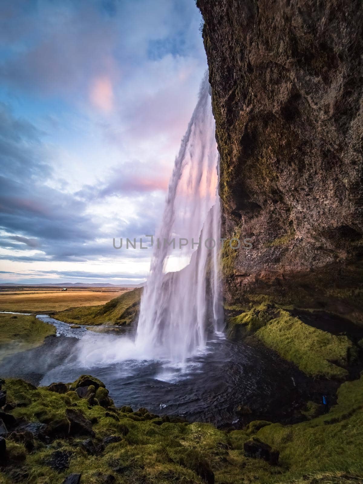 Seljalandsfoss waterfall wide angle at dawn, vertical composition by FerradalFCG