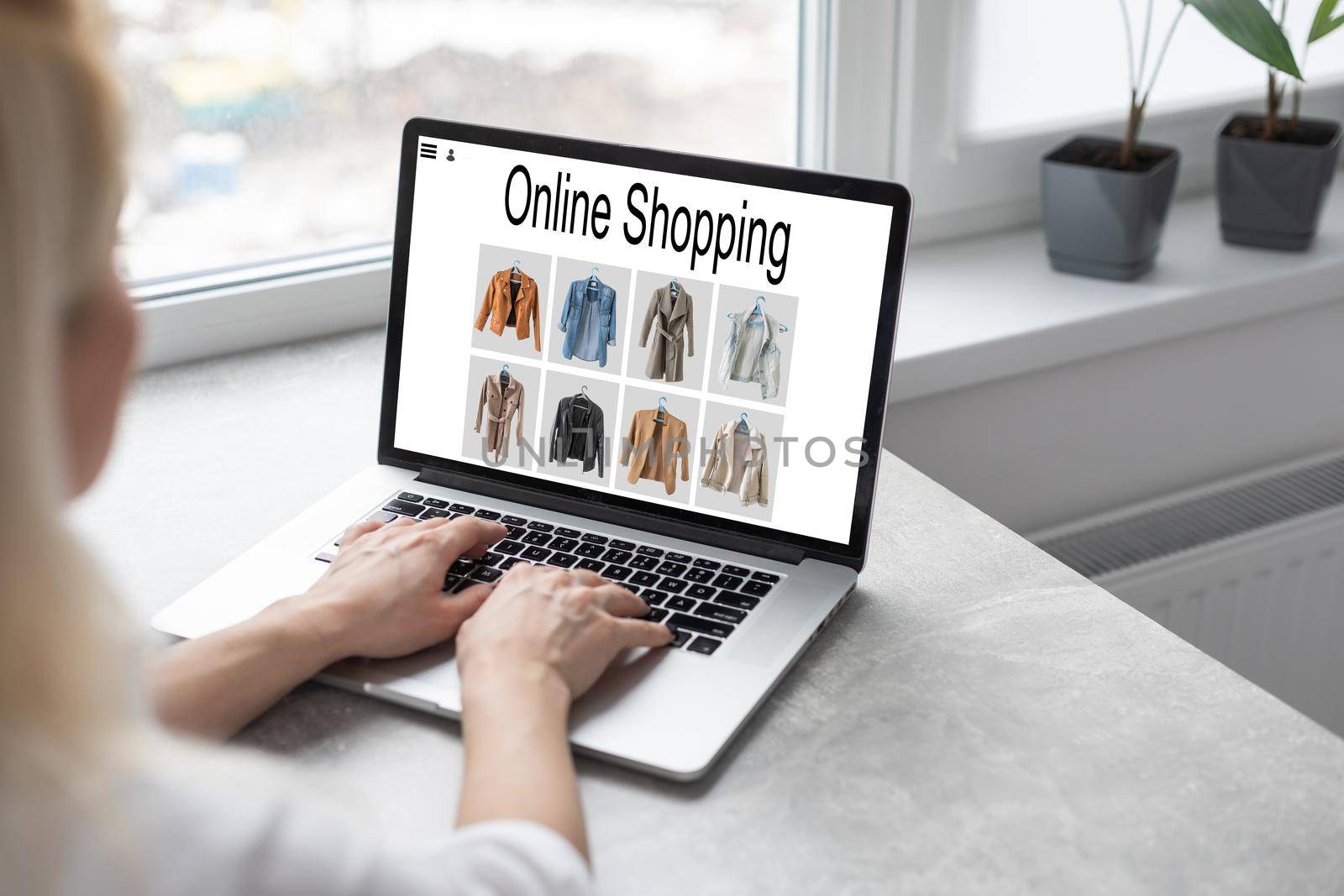 Online Shopping Website on Laptop. Easy E-commerce Website Shop by Smartphone, iPhone, iPad and Laptop. Close up Hands Using Smartphone Shopping Cart read Online Article, Blog. Digital Payment gateway by Andelov13