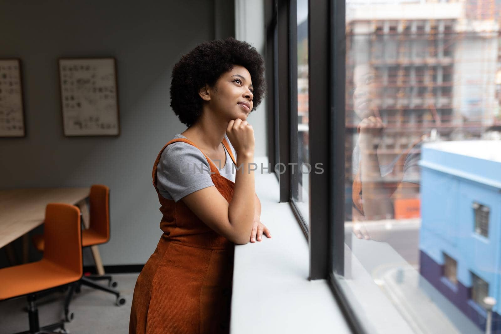 Mixed race businesswoman working in creative office by Wavebreakmedia