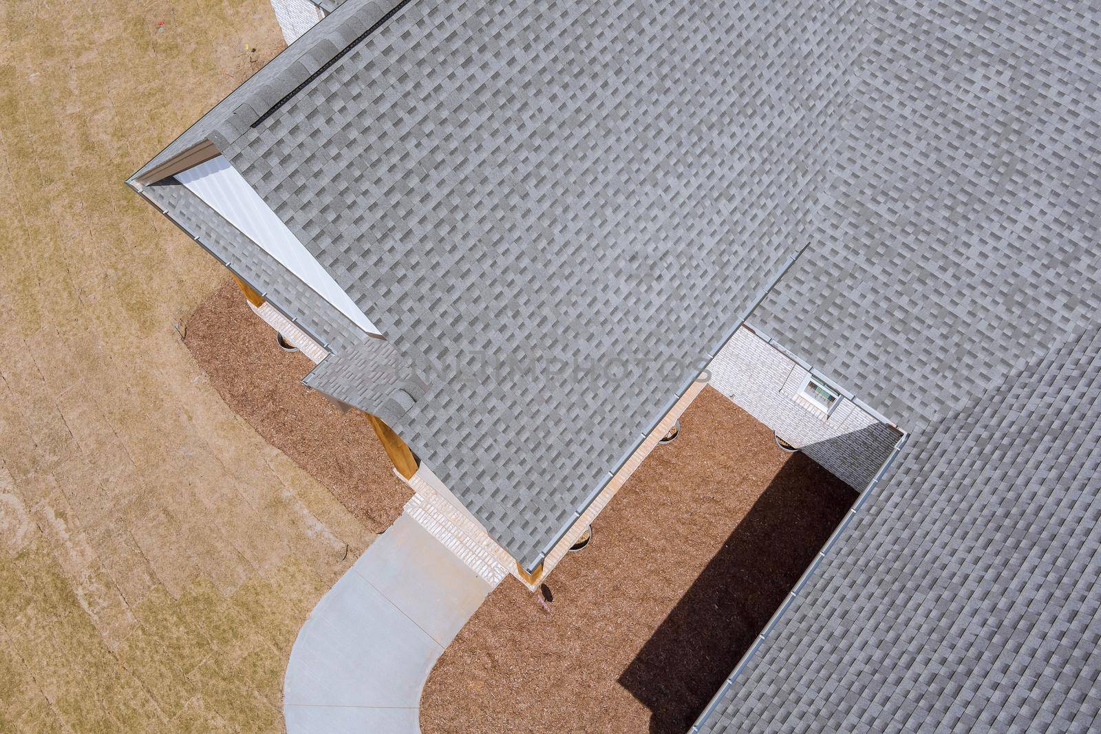 Aerial view of roof shingles rooftop construction the edge on top of the new house asphalt tiles